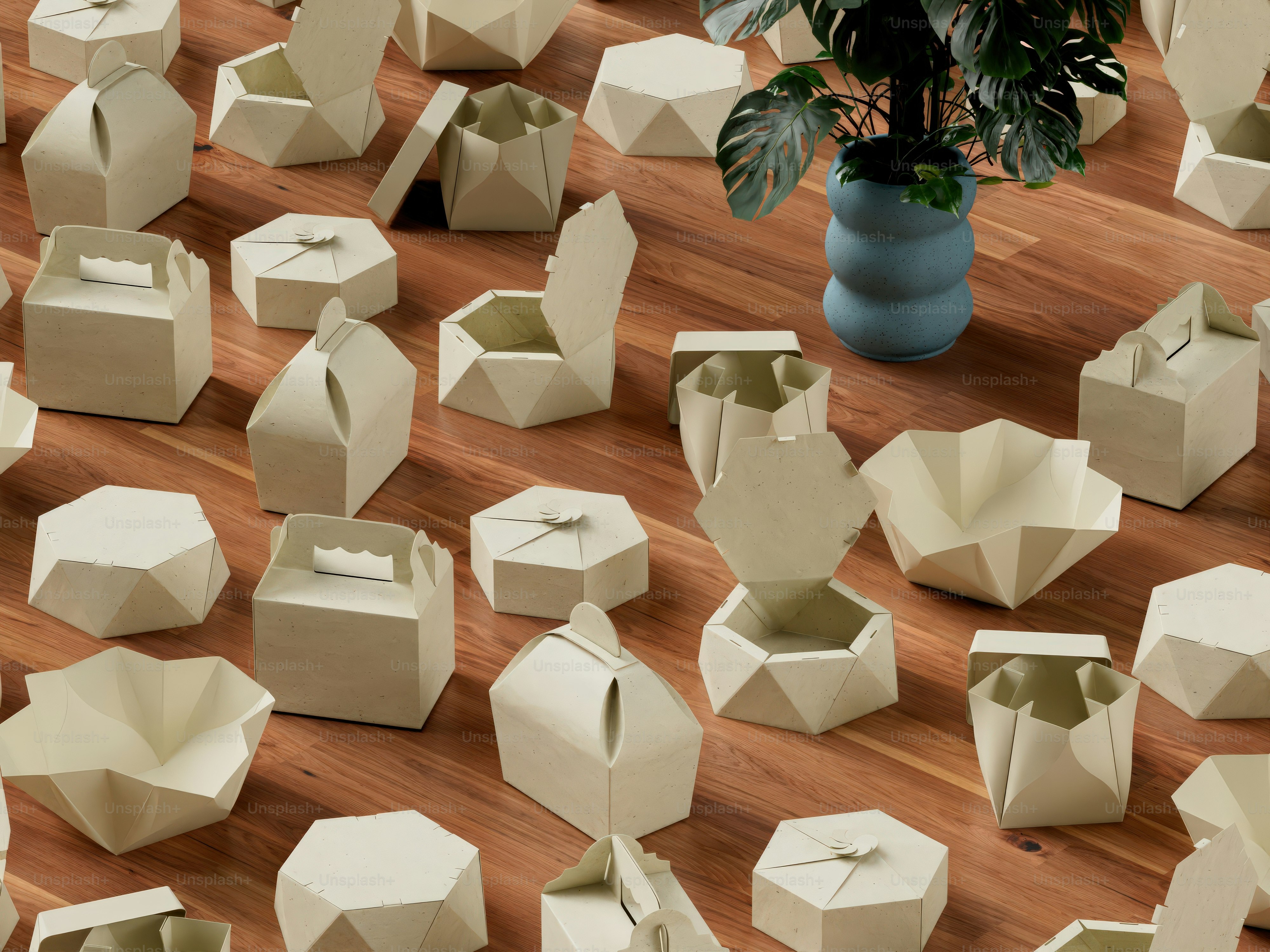 A bunch of white boxes sitting on top of a wooden floor