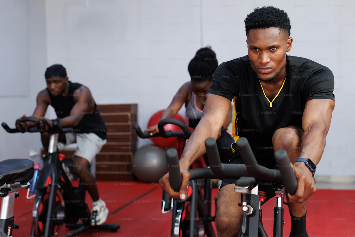 Group training on stationary bikes during an indoor cycling session