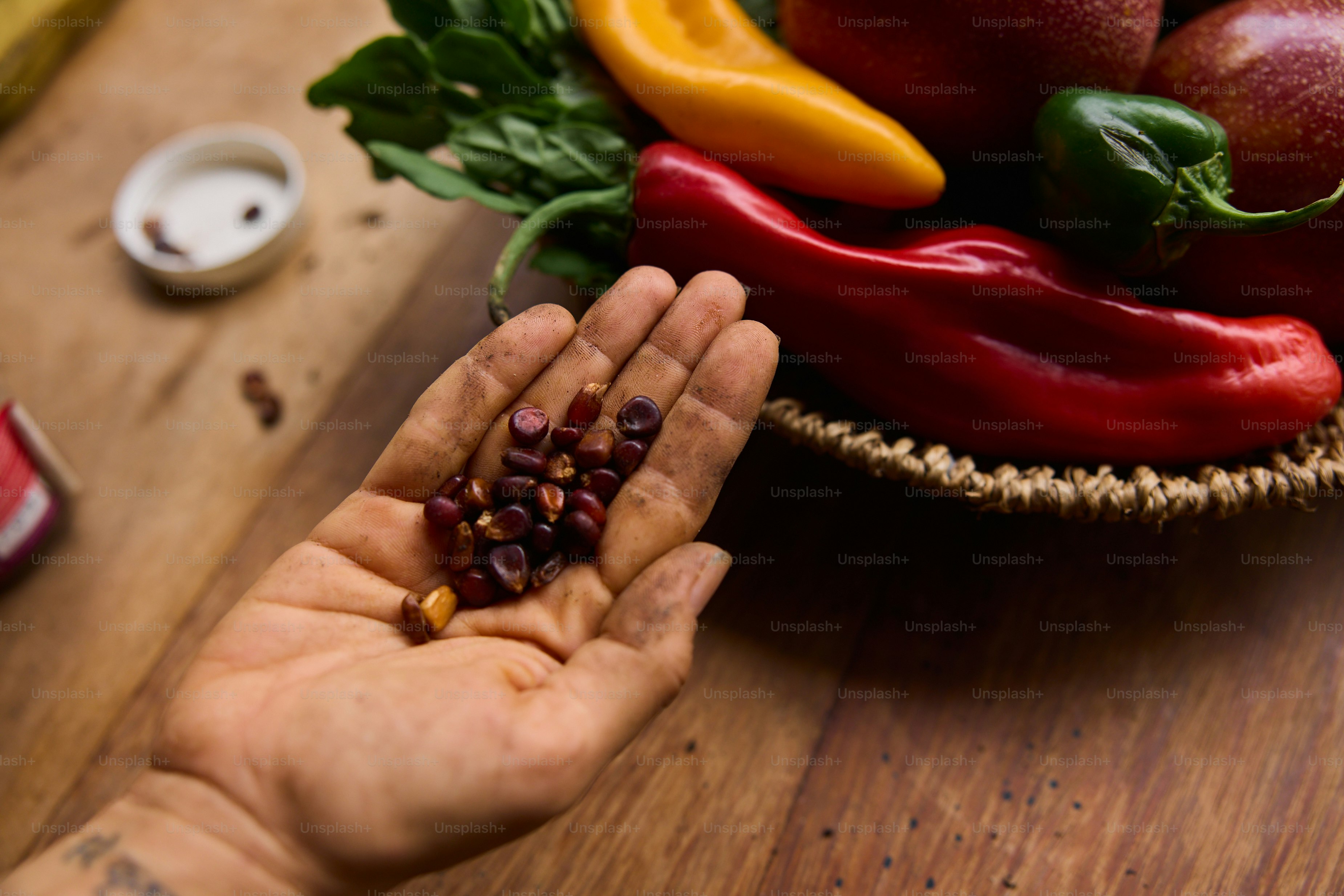 A person holding a handful of fruit and vegetables