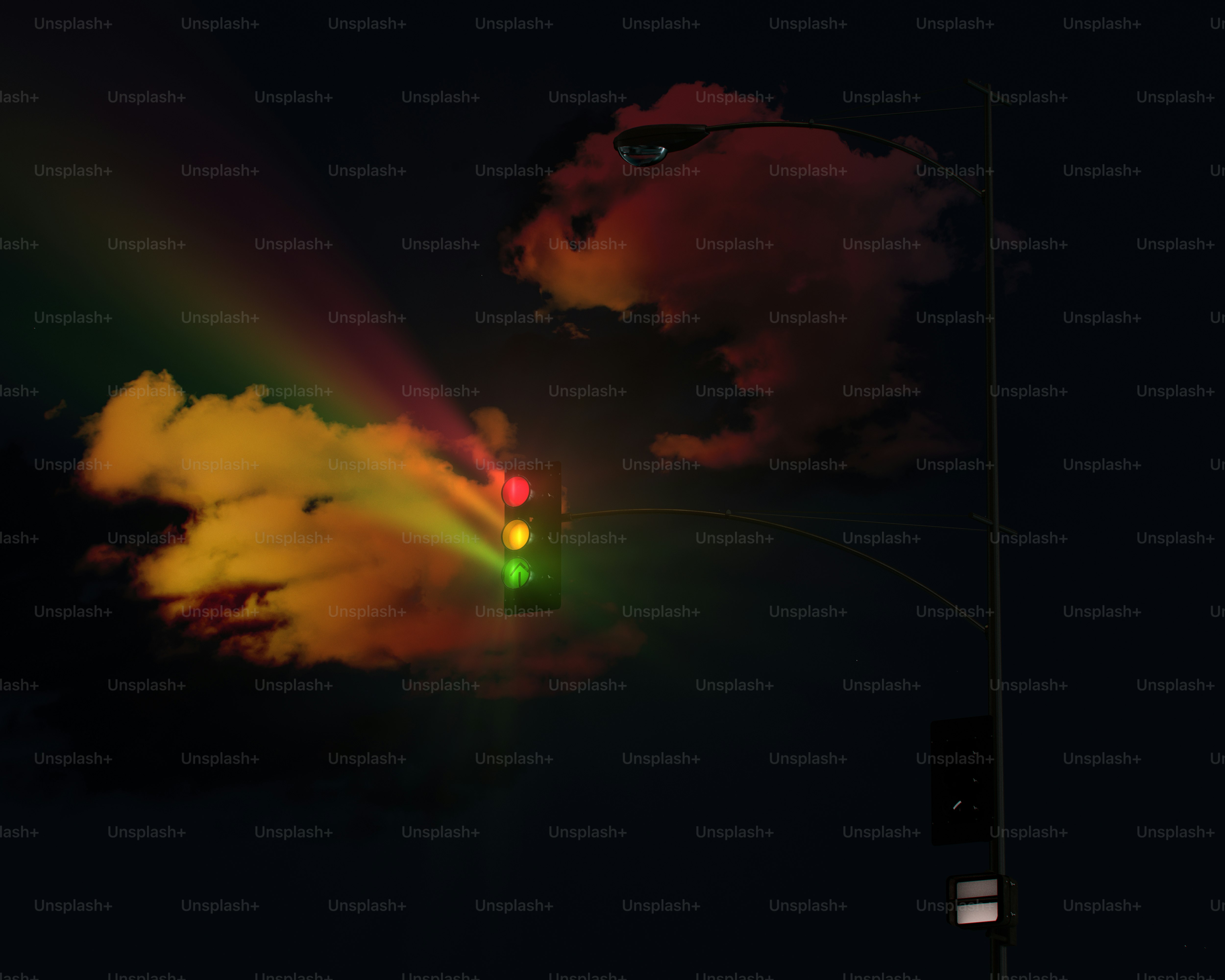 A green and yellow light is shining in the sky