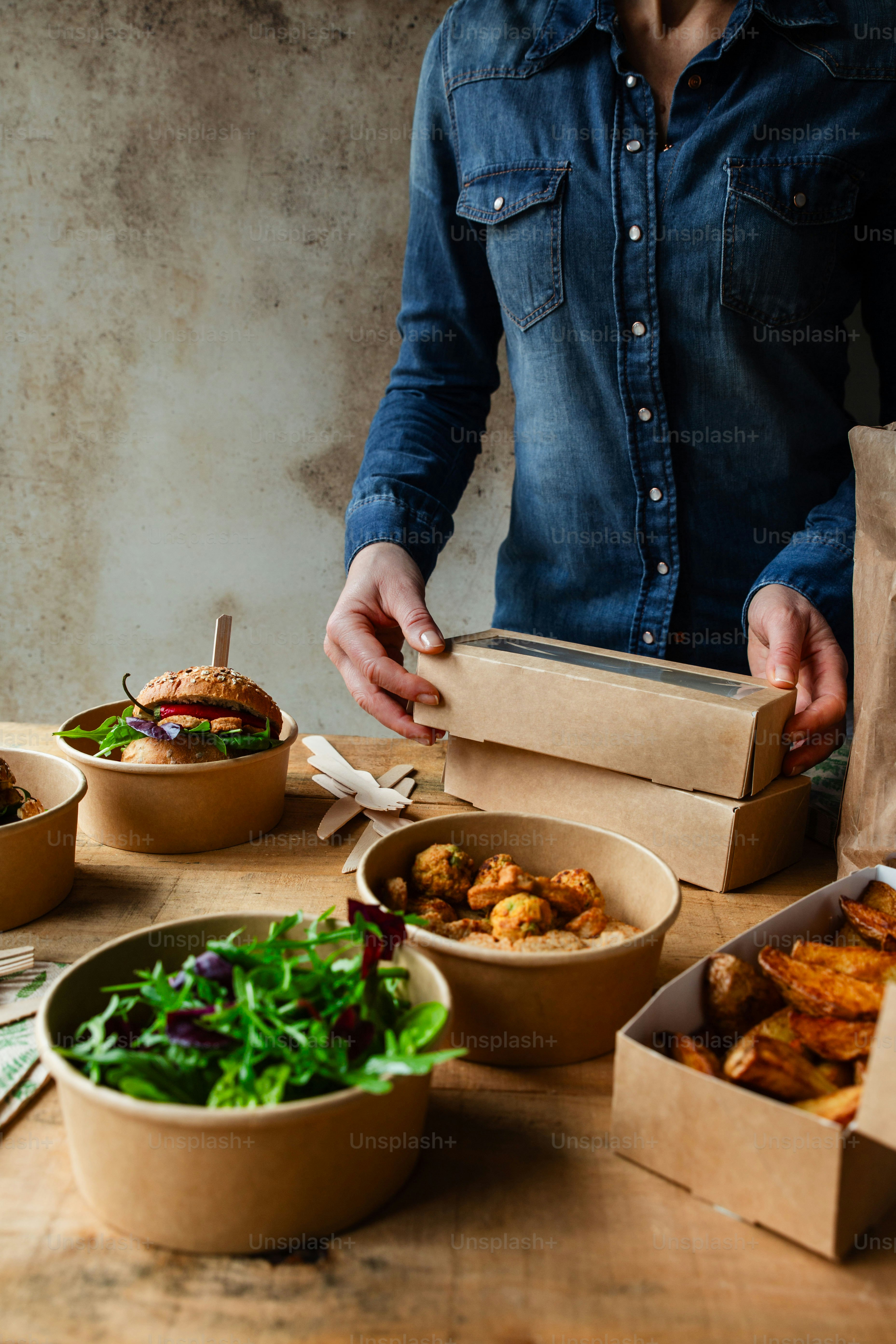 A man standing in front of a table filled with food