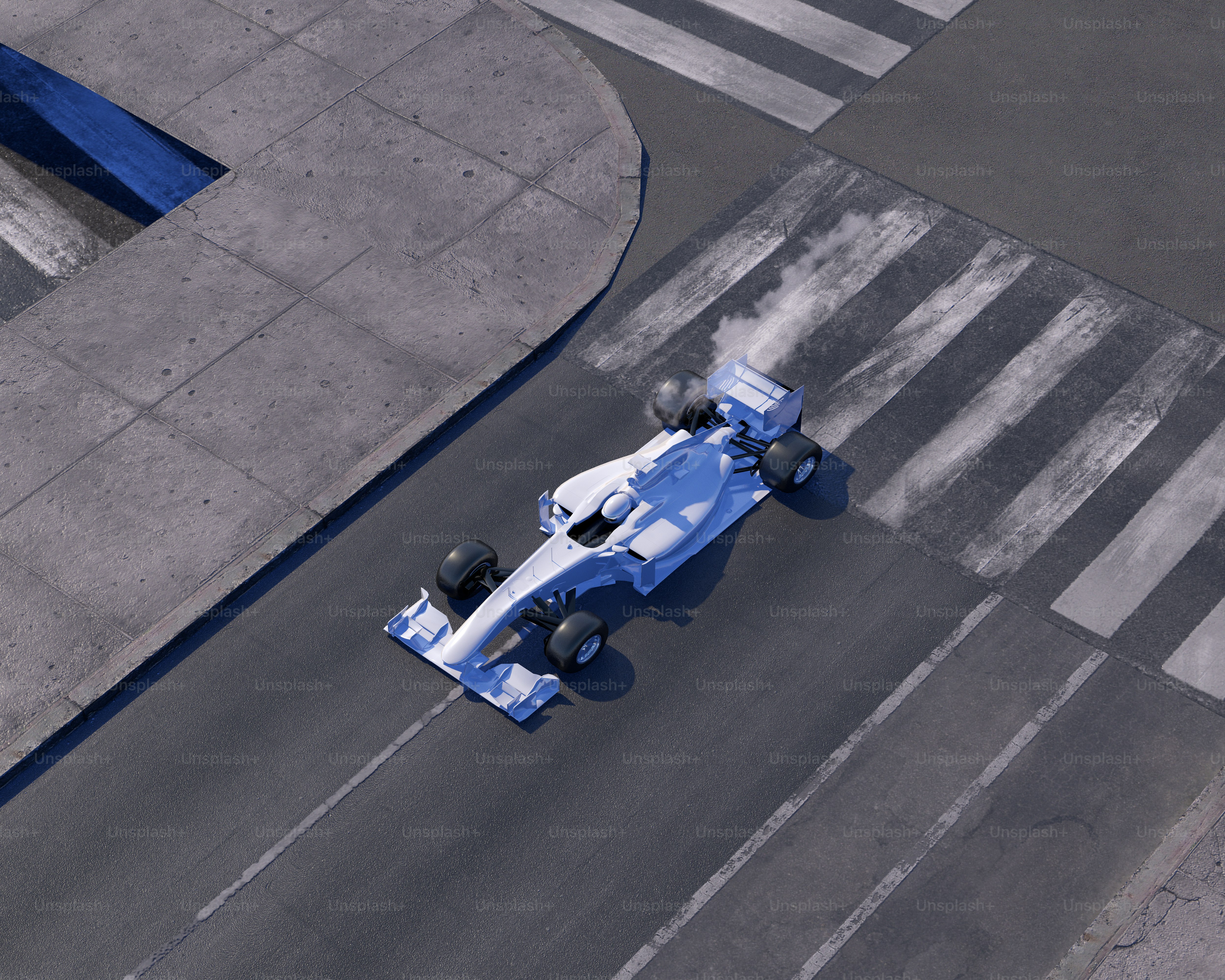 A blue and white race car driving down a street