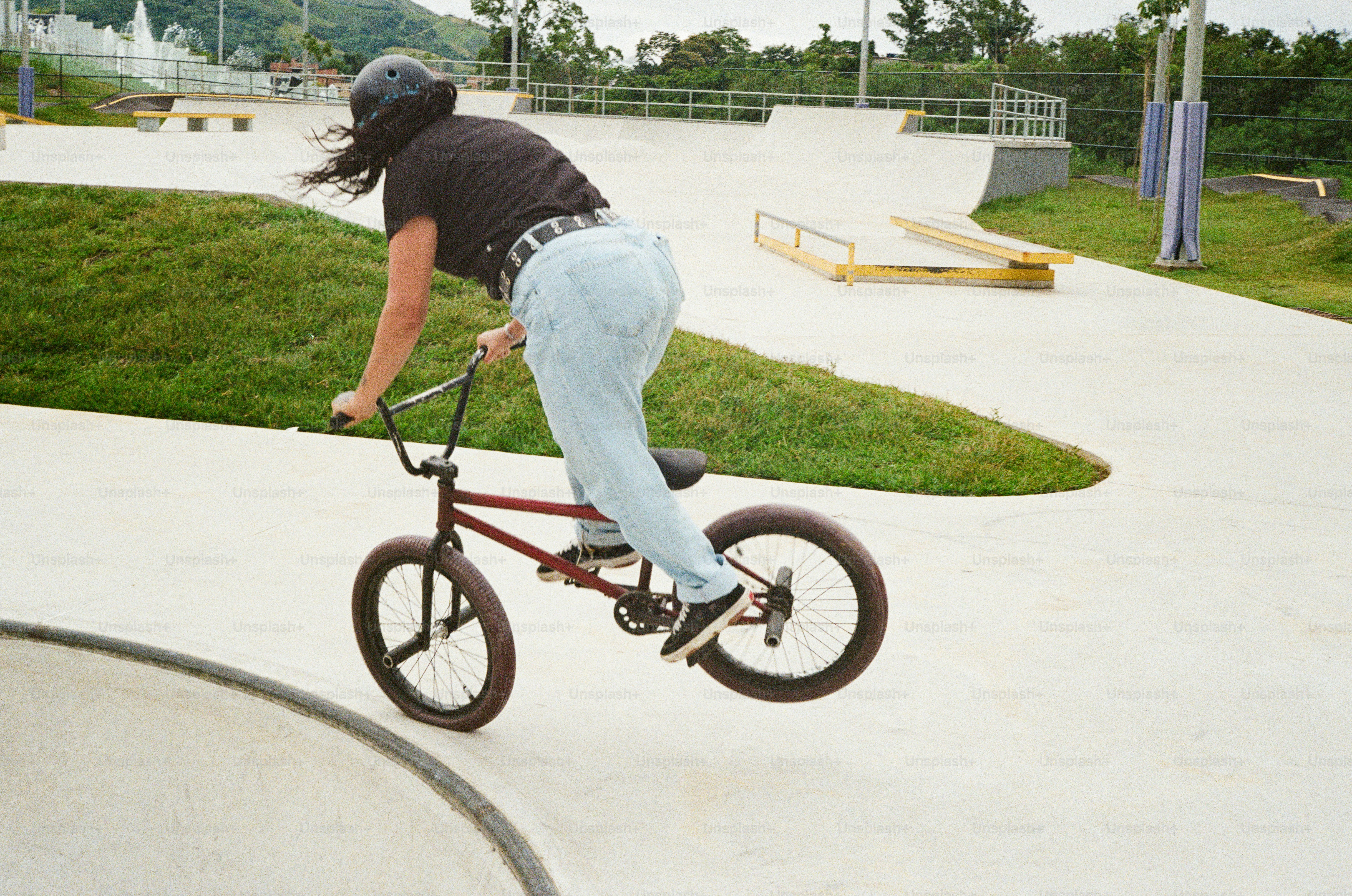 A person riding a bike in a skate park