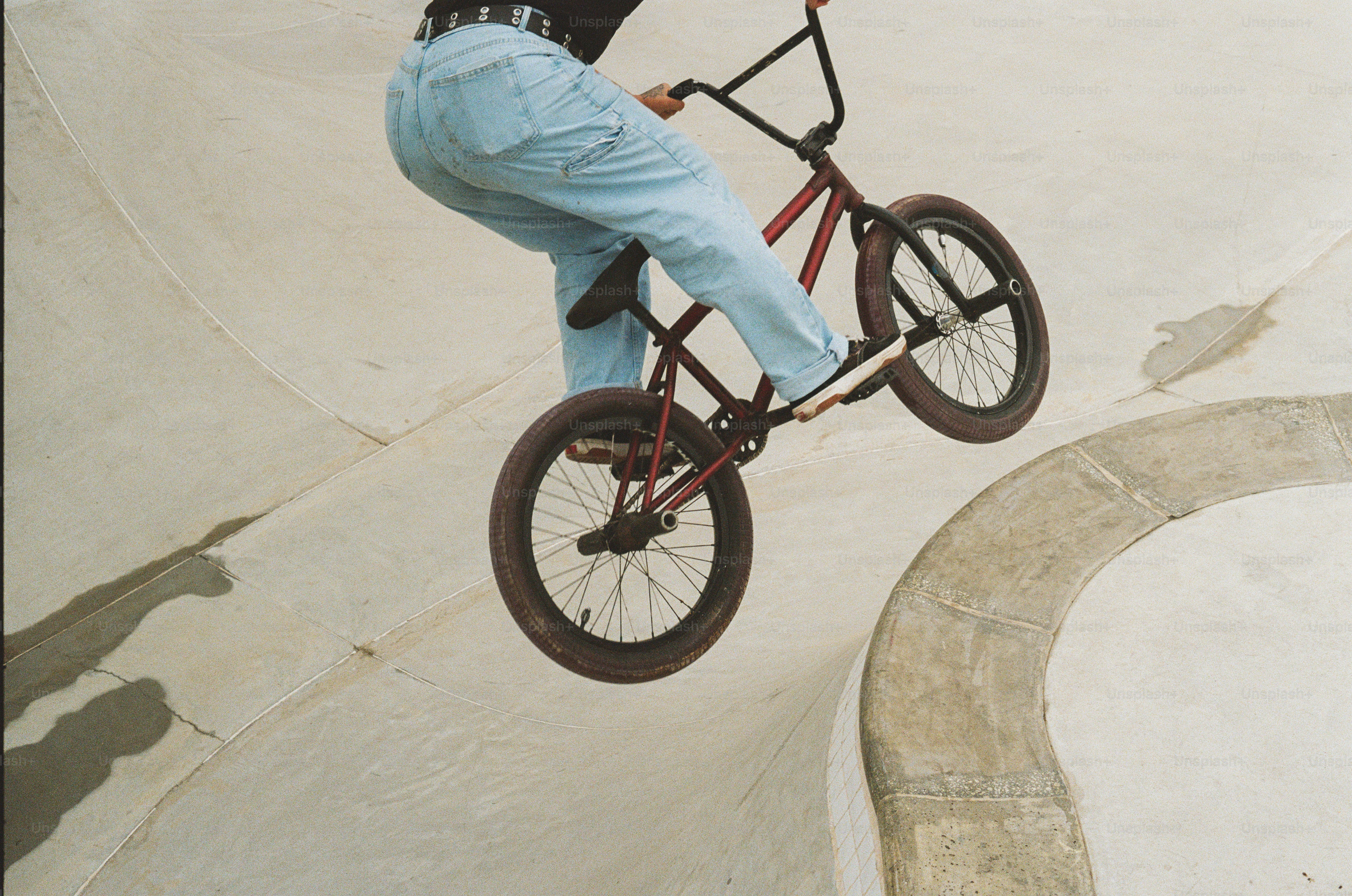 A man riding a bike up the side of a ramp photo – Sports Image on Unsplash