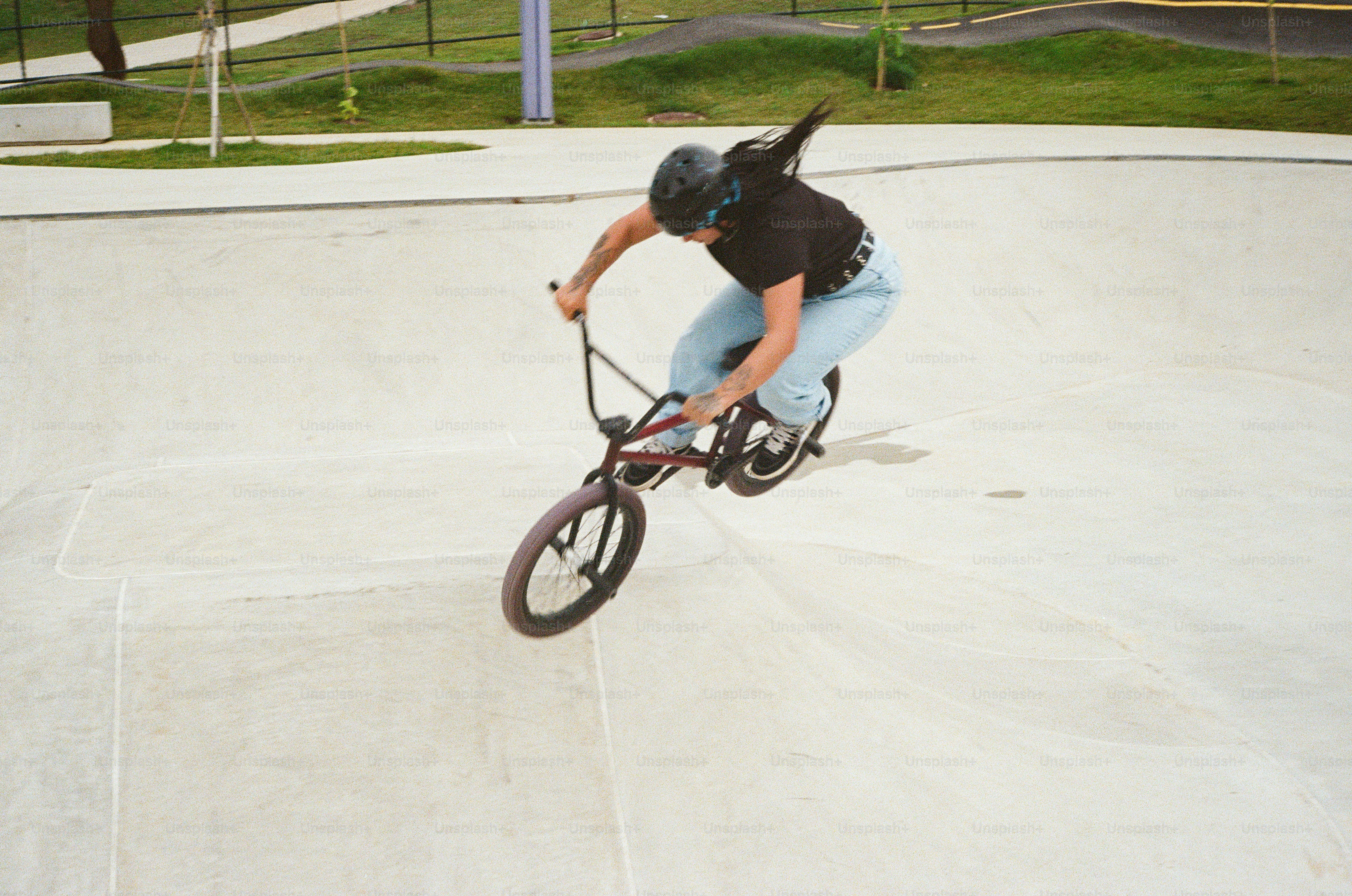 A person riding a bike on a ramp