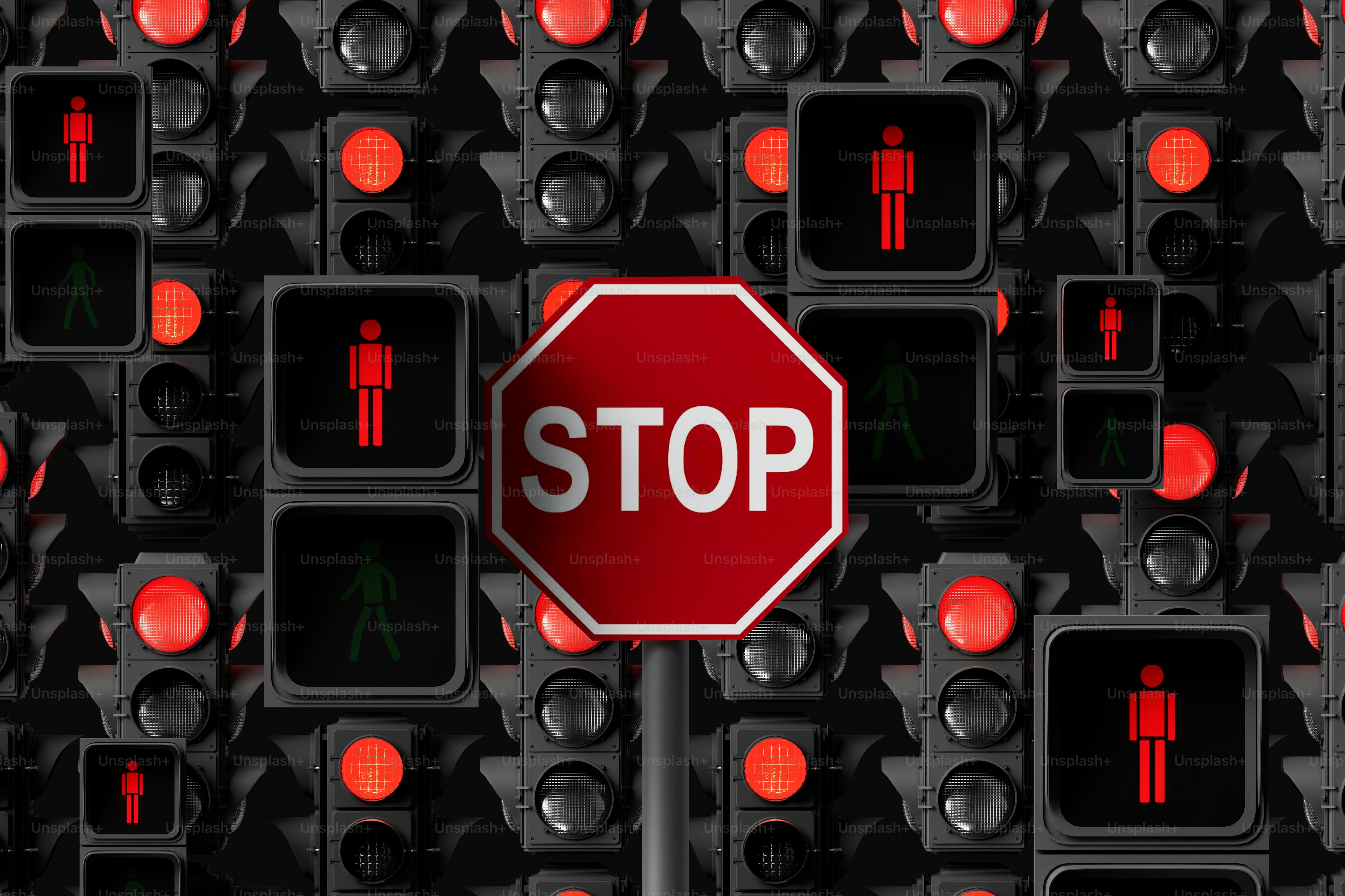 Un panneau d’arrêt entouré de nombreux feux tricolores