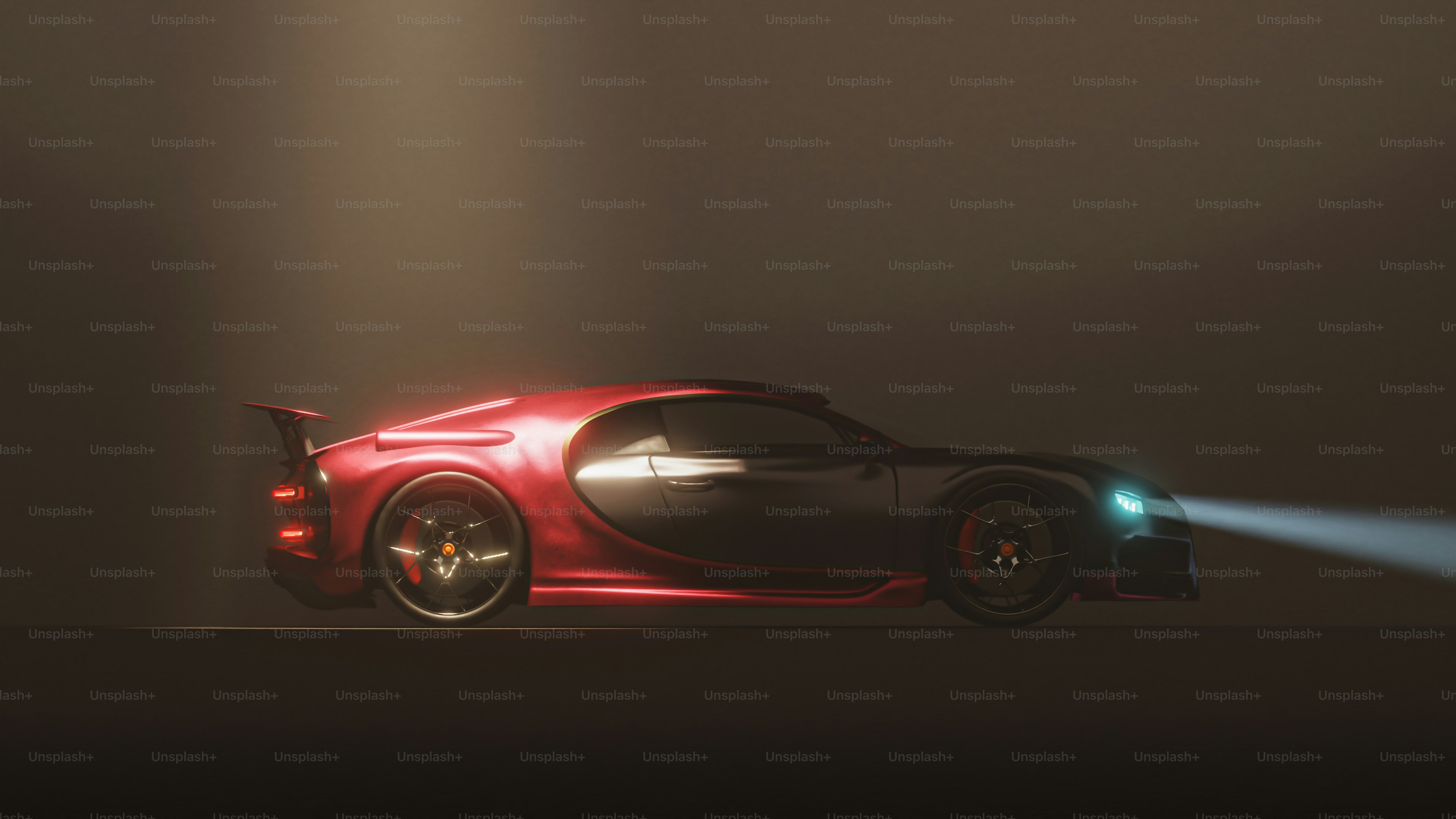 A red sports car driving through a dark room