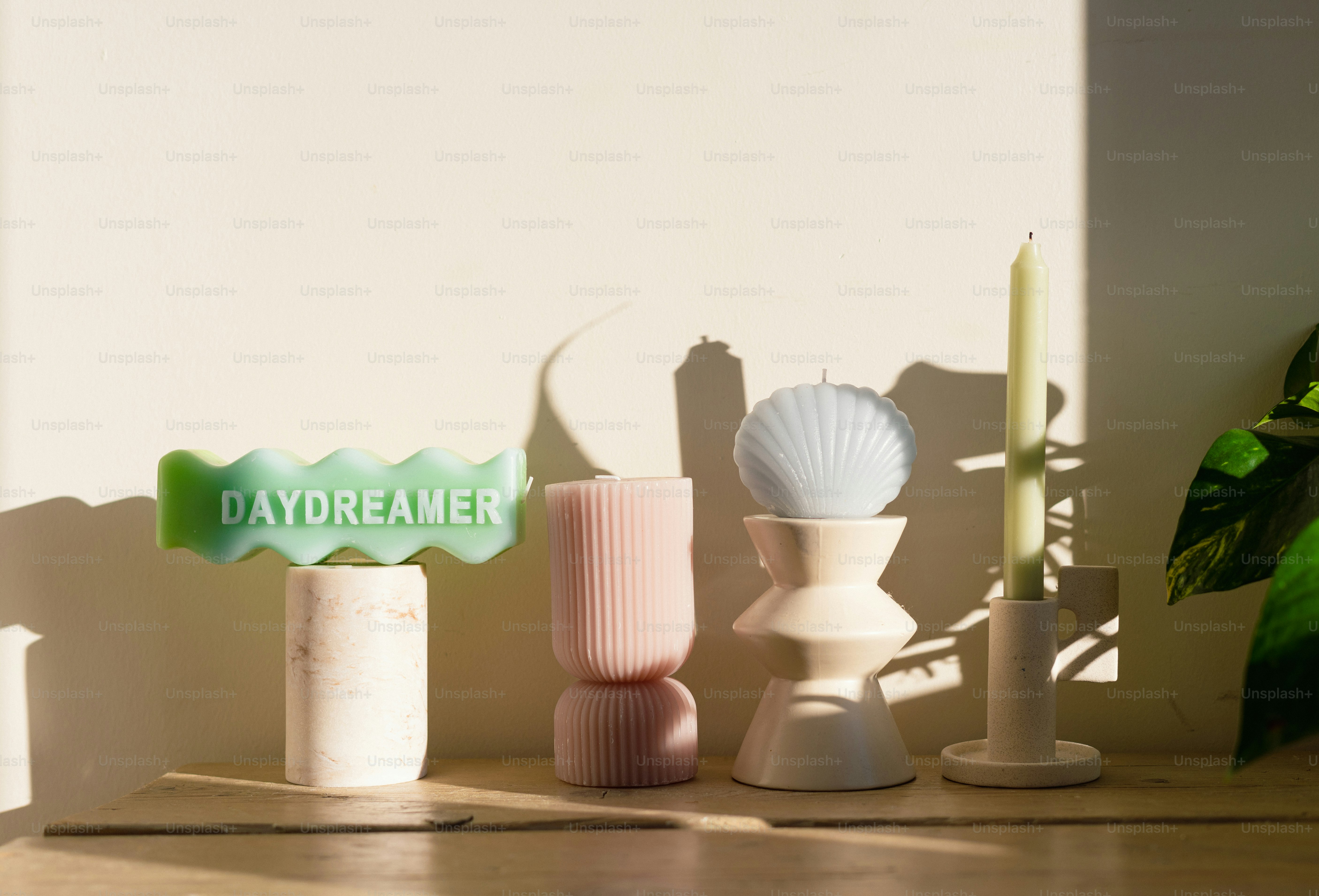A group of vases sitting on top of a wooden table