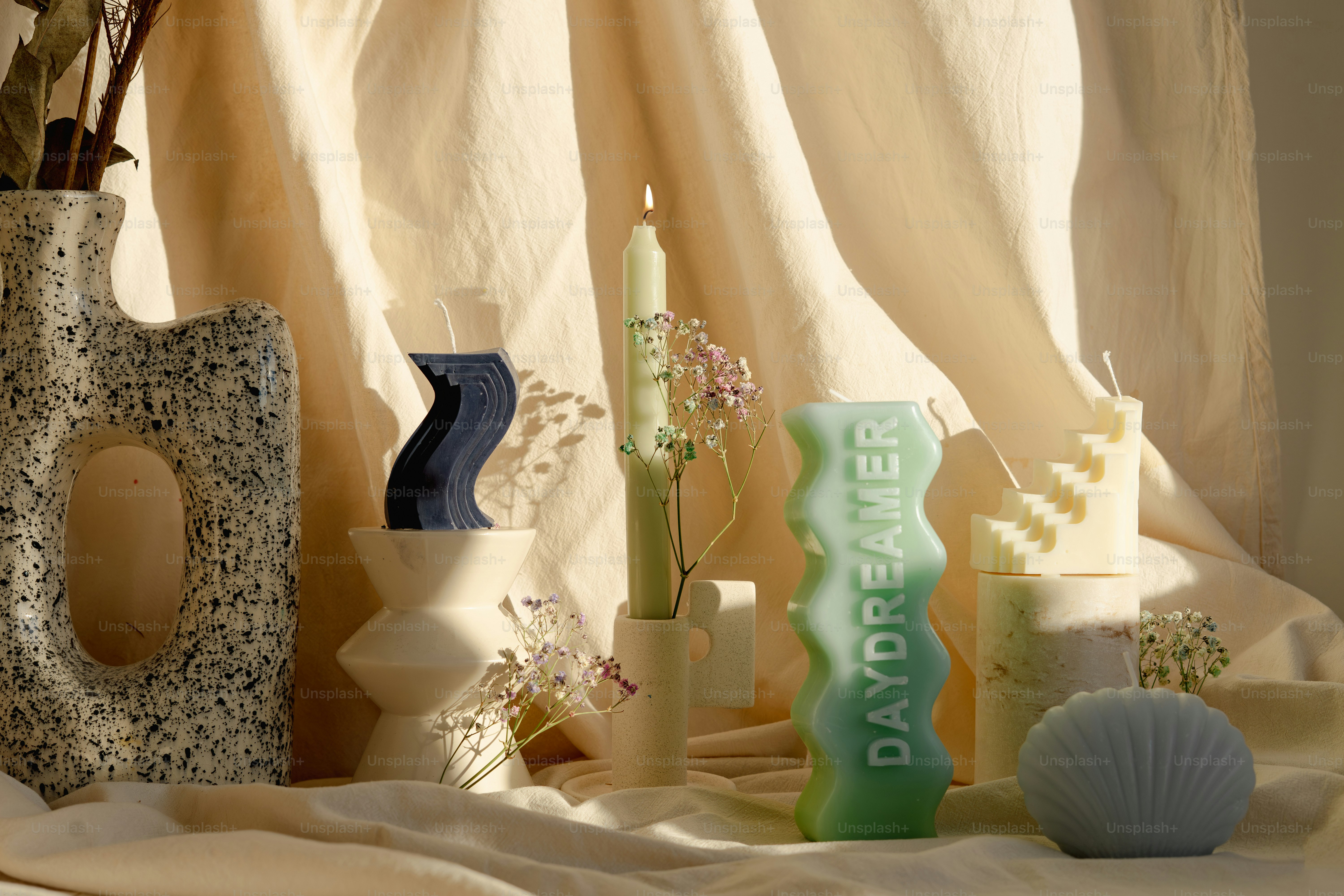 A table topped with a vase filled with flowers