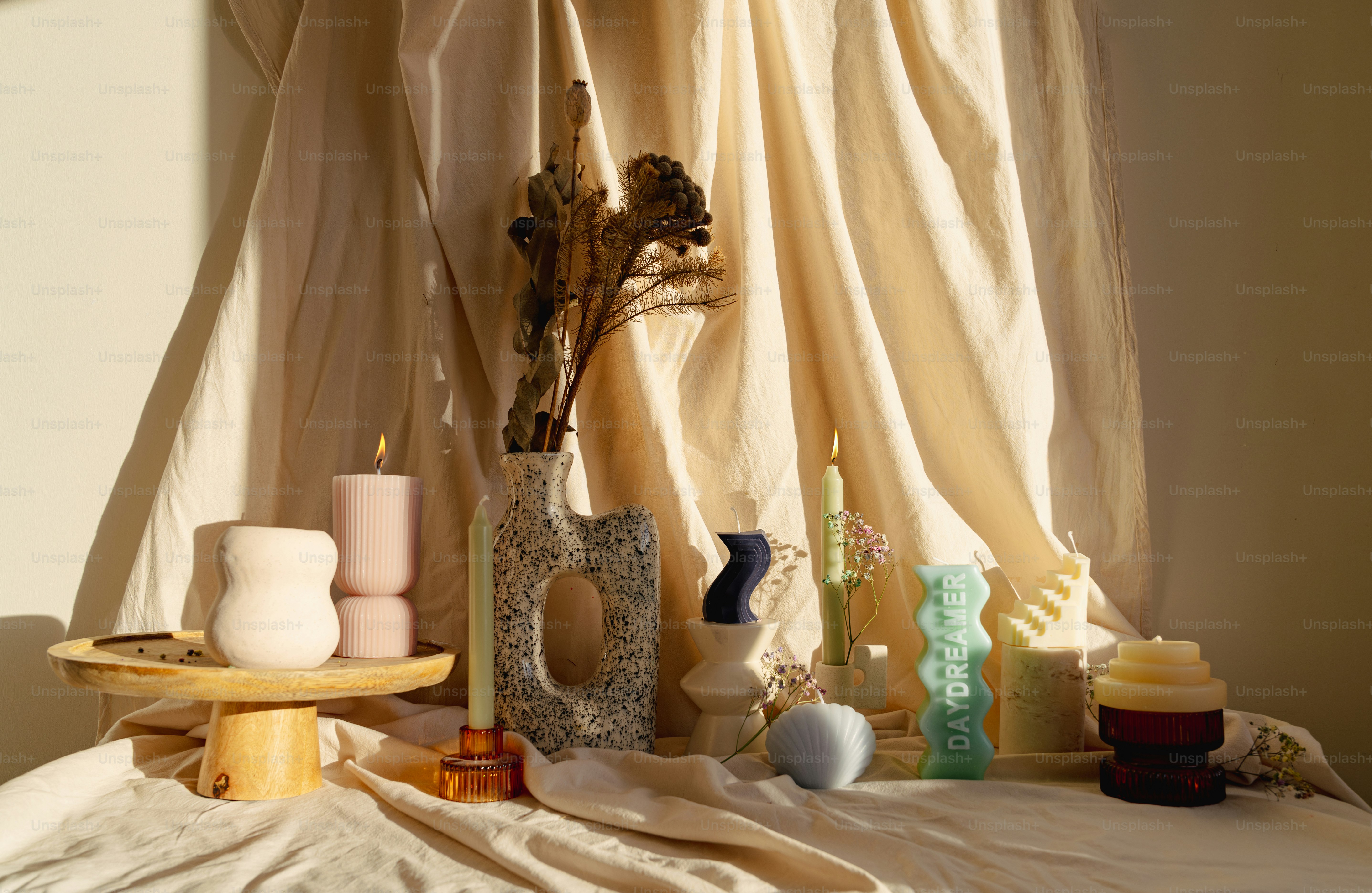 A room with a bed covered in a white sheet