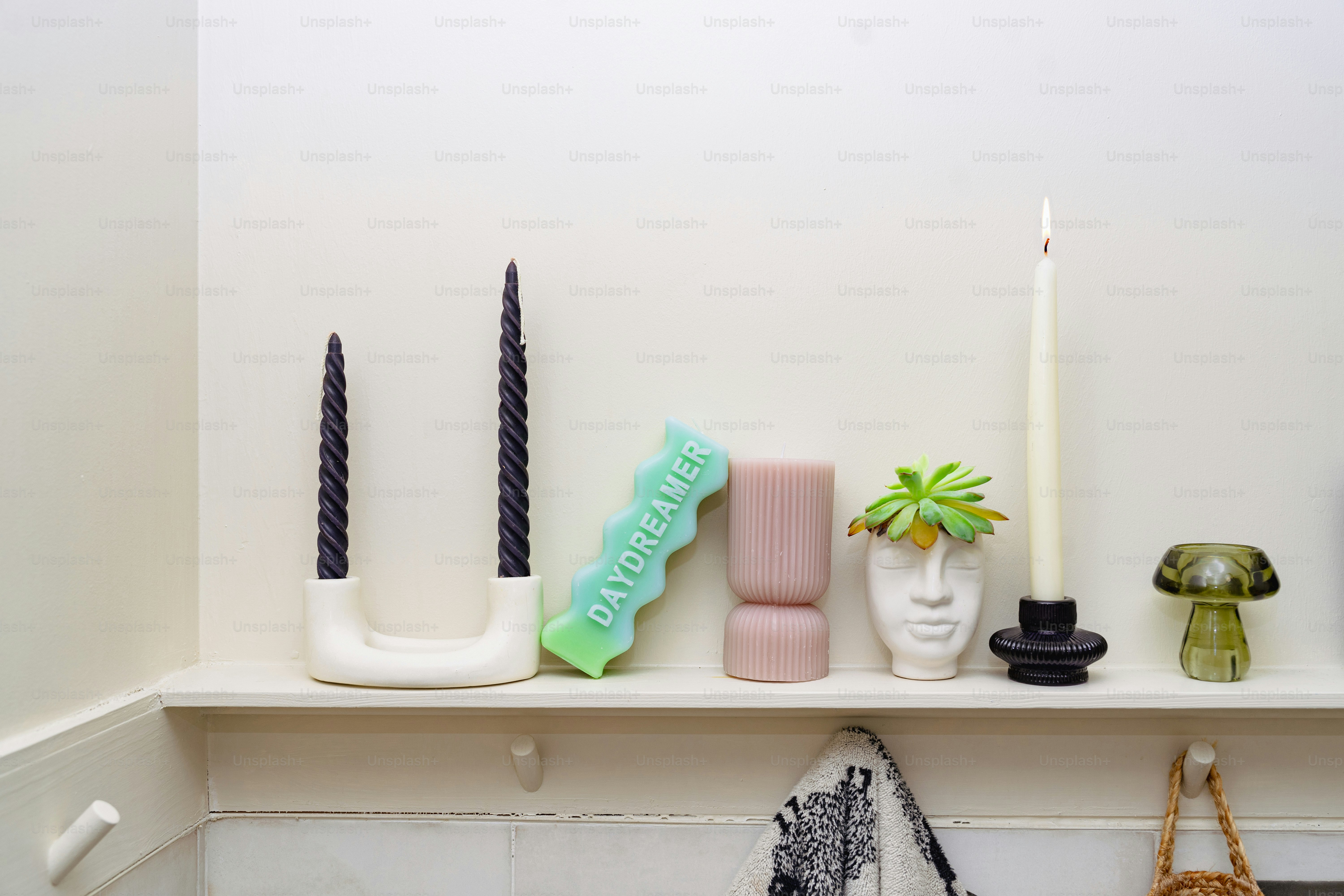 A shelf with candles and other items on it