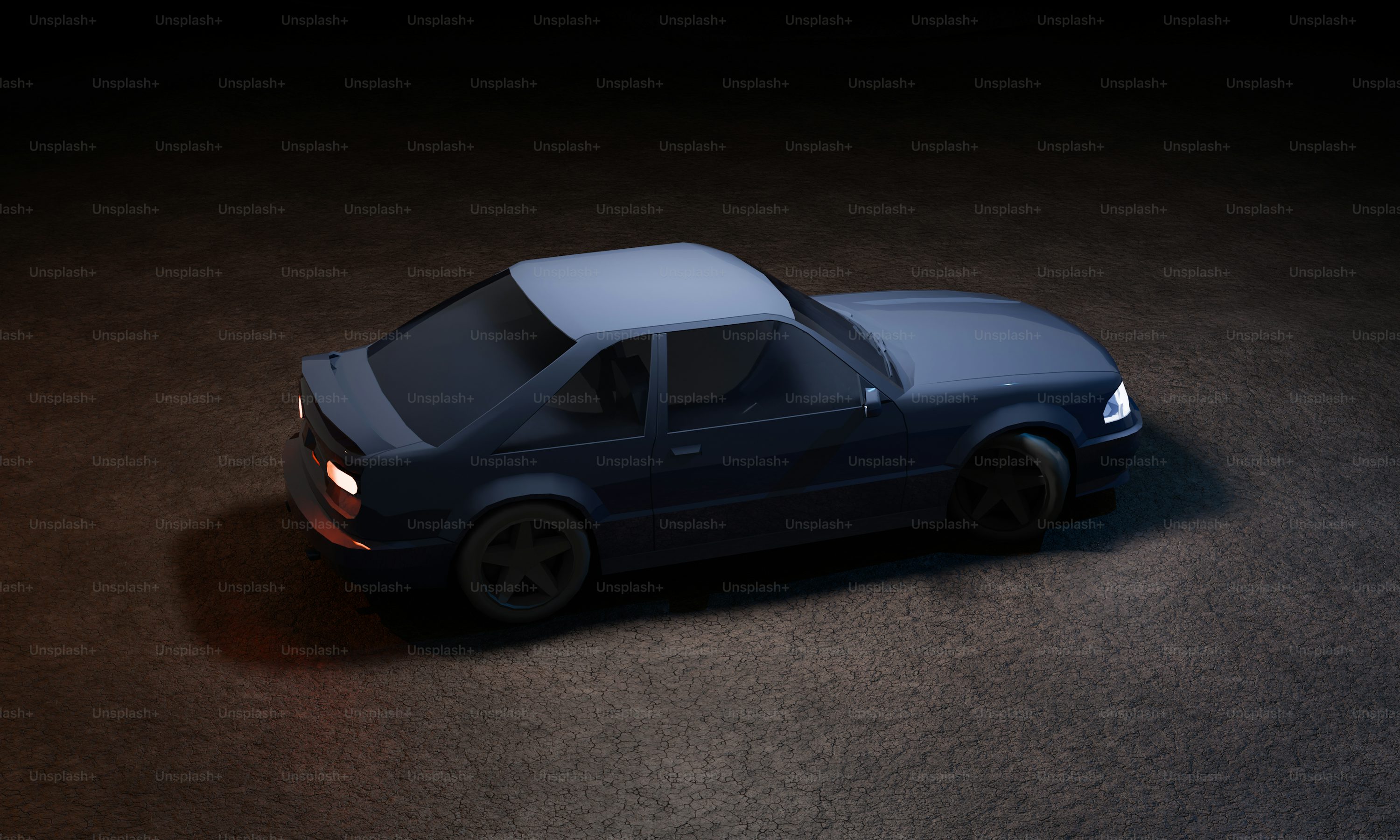 A blue car is parked on a dark surface