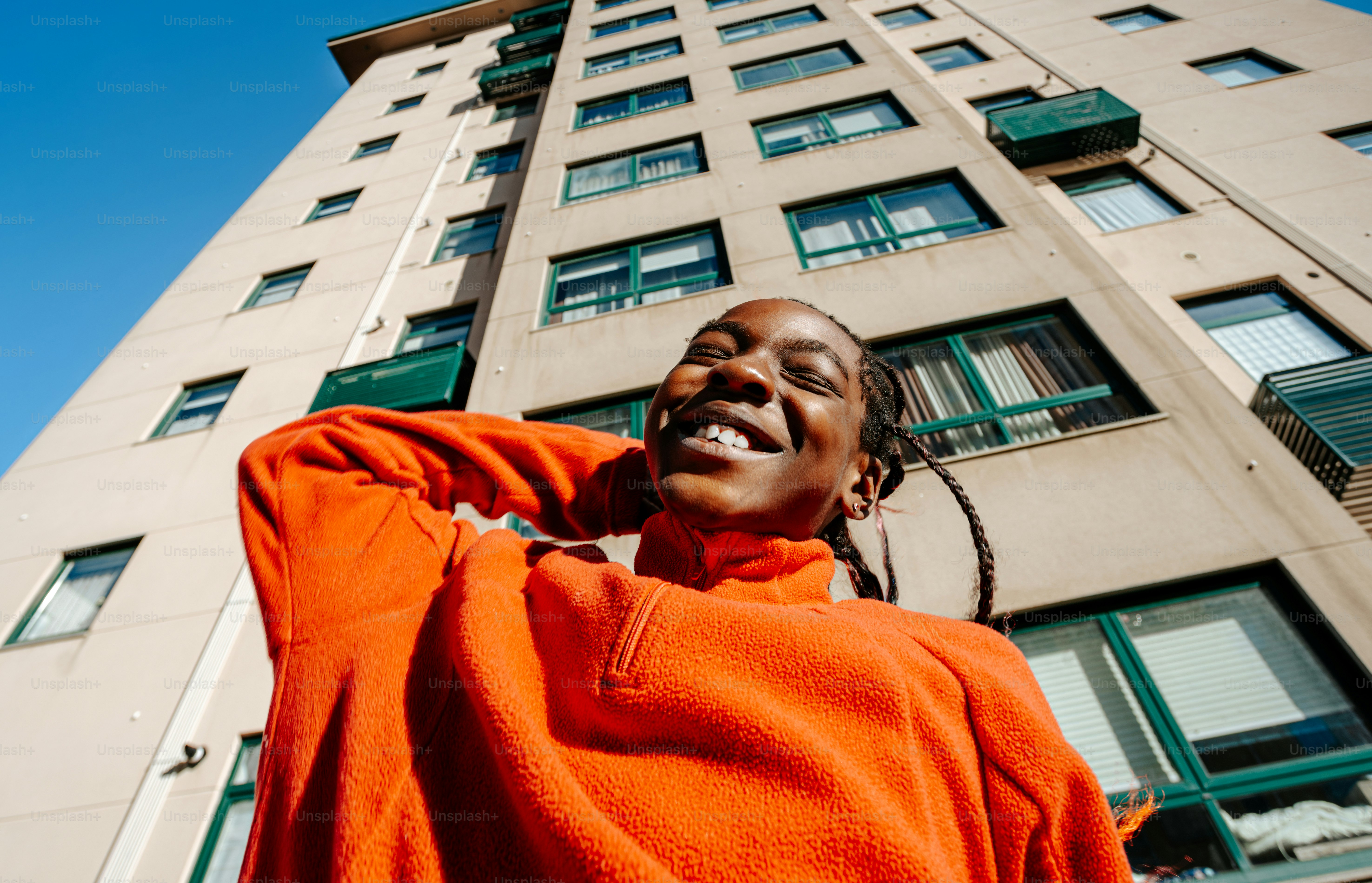 A man standing in front of a tall building
