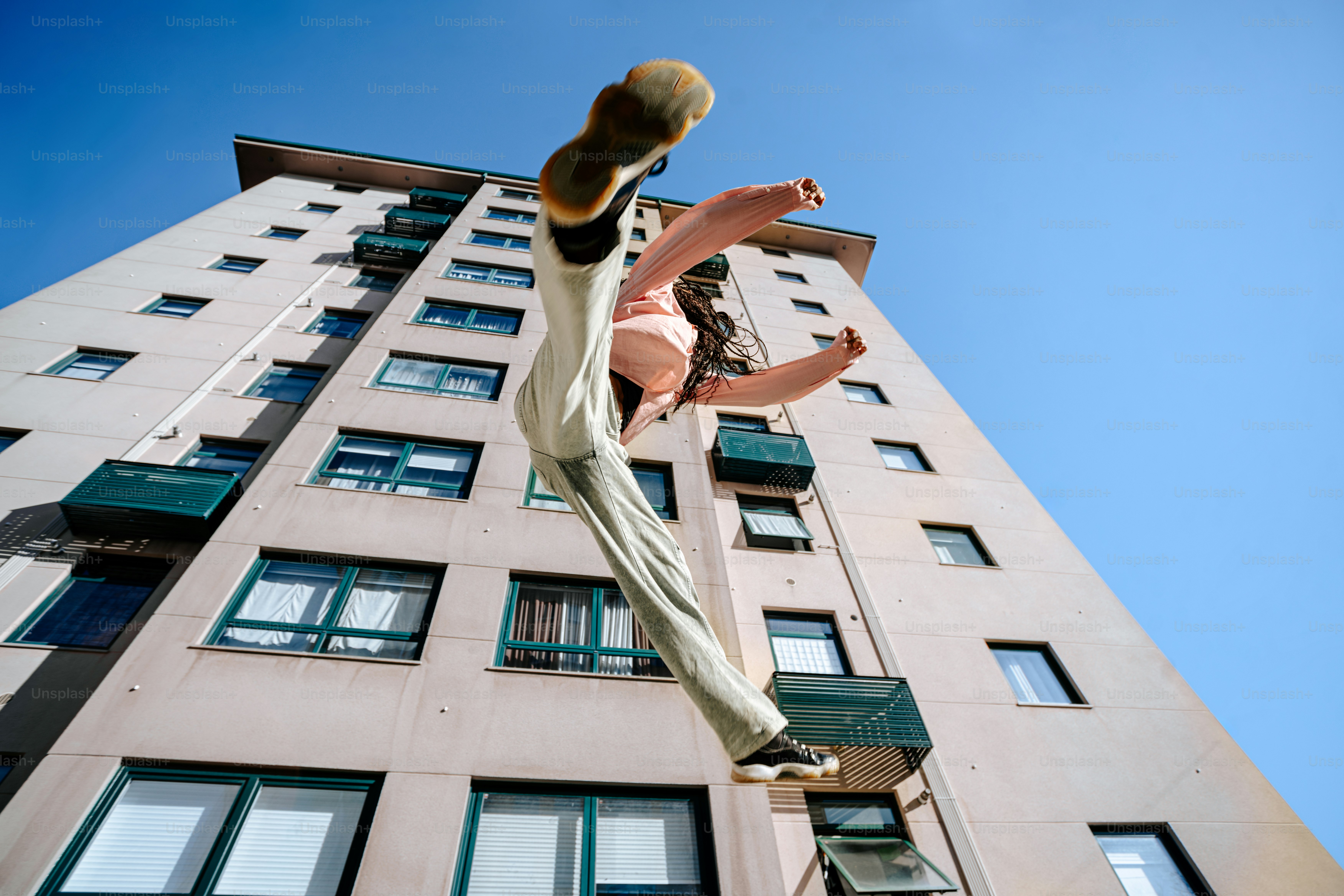 A man flying through the air while riding a skateboard