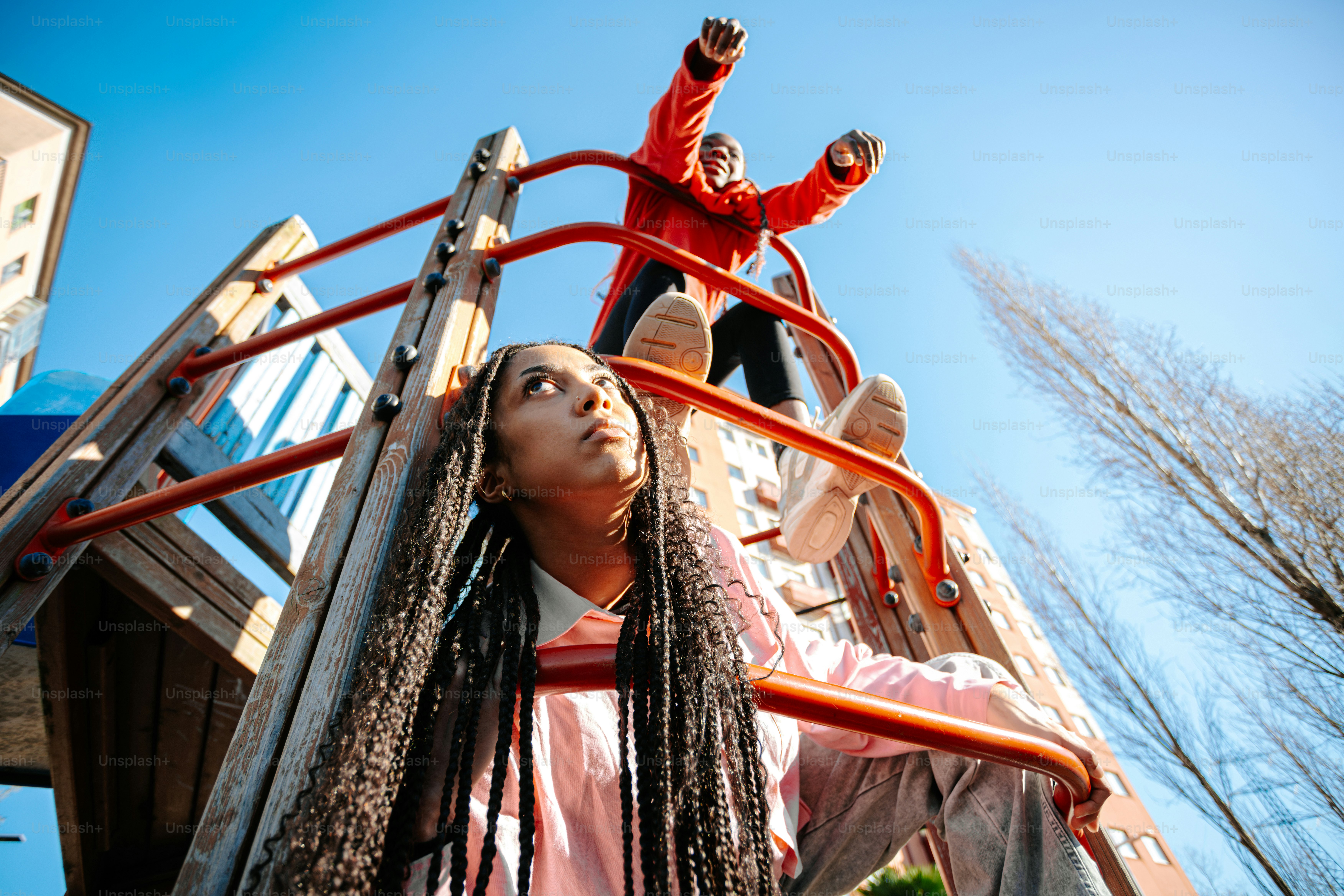A group of people standing on top of a slide