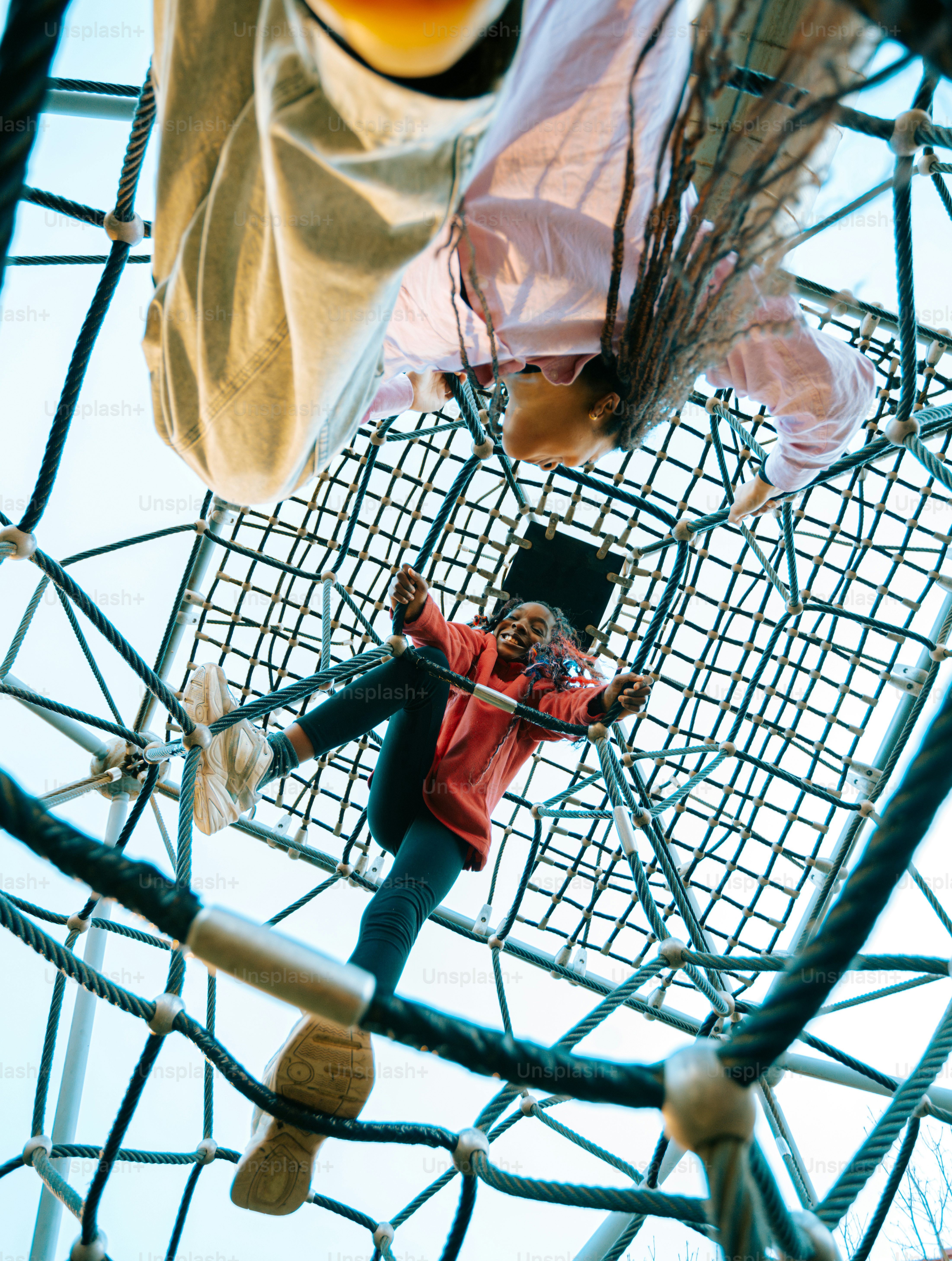 A man standing on top of a metal structure