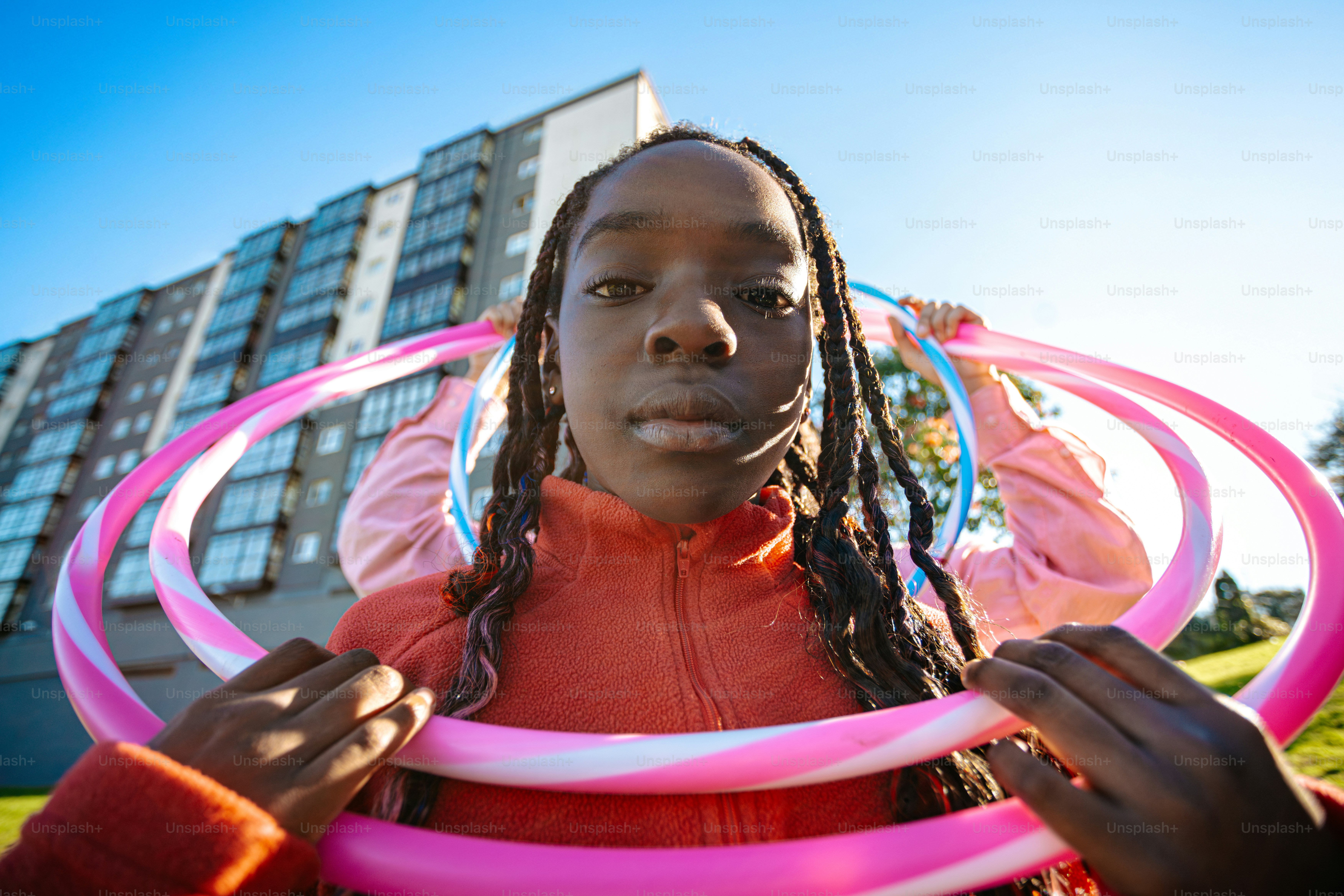 A girl holding a hula hoop in her hands