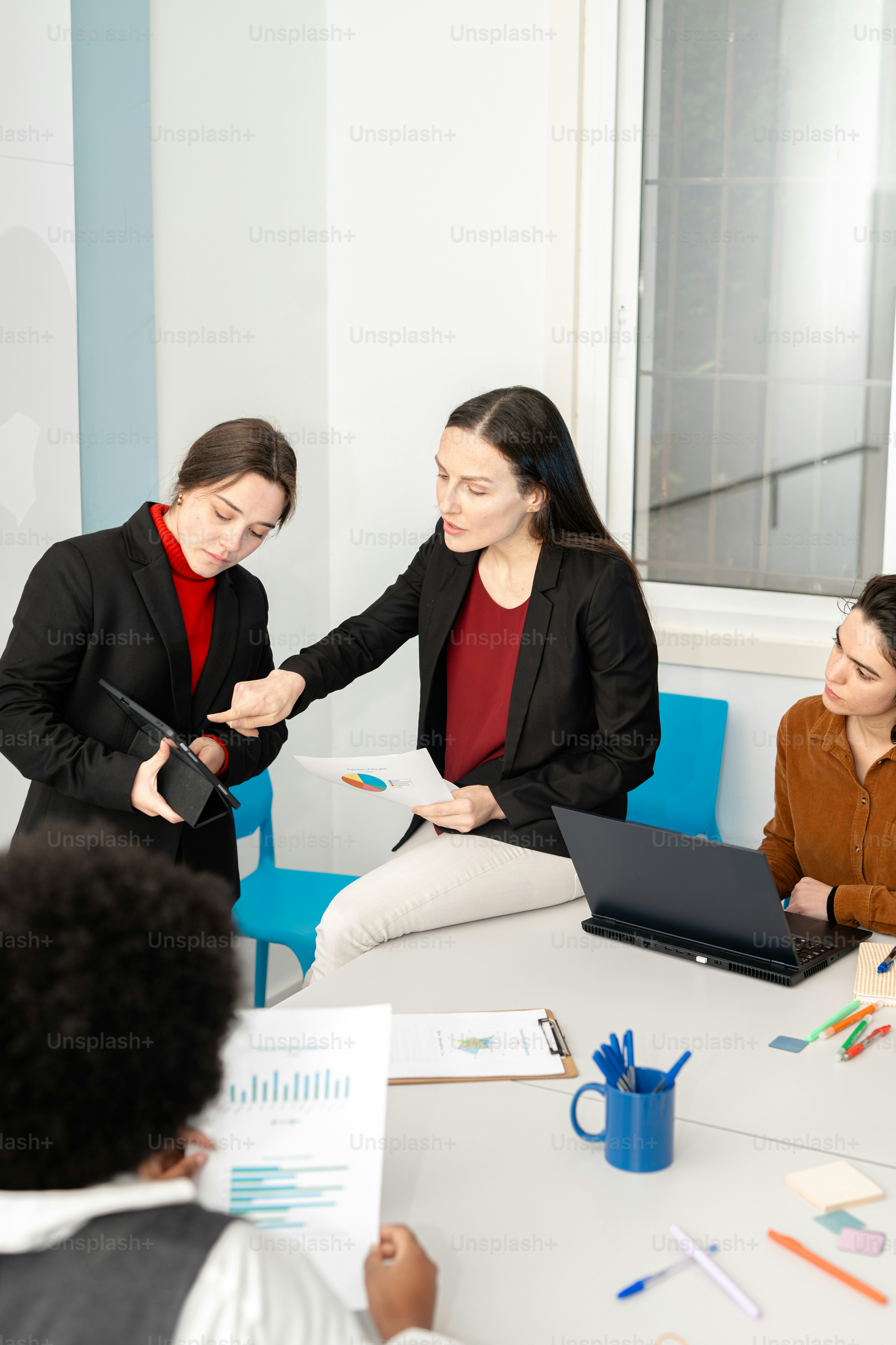 A group of people sitting around a table