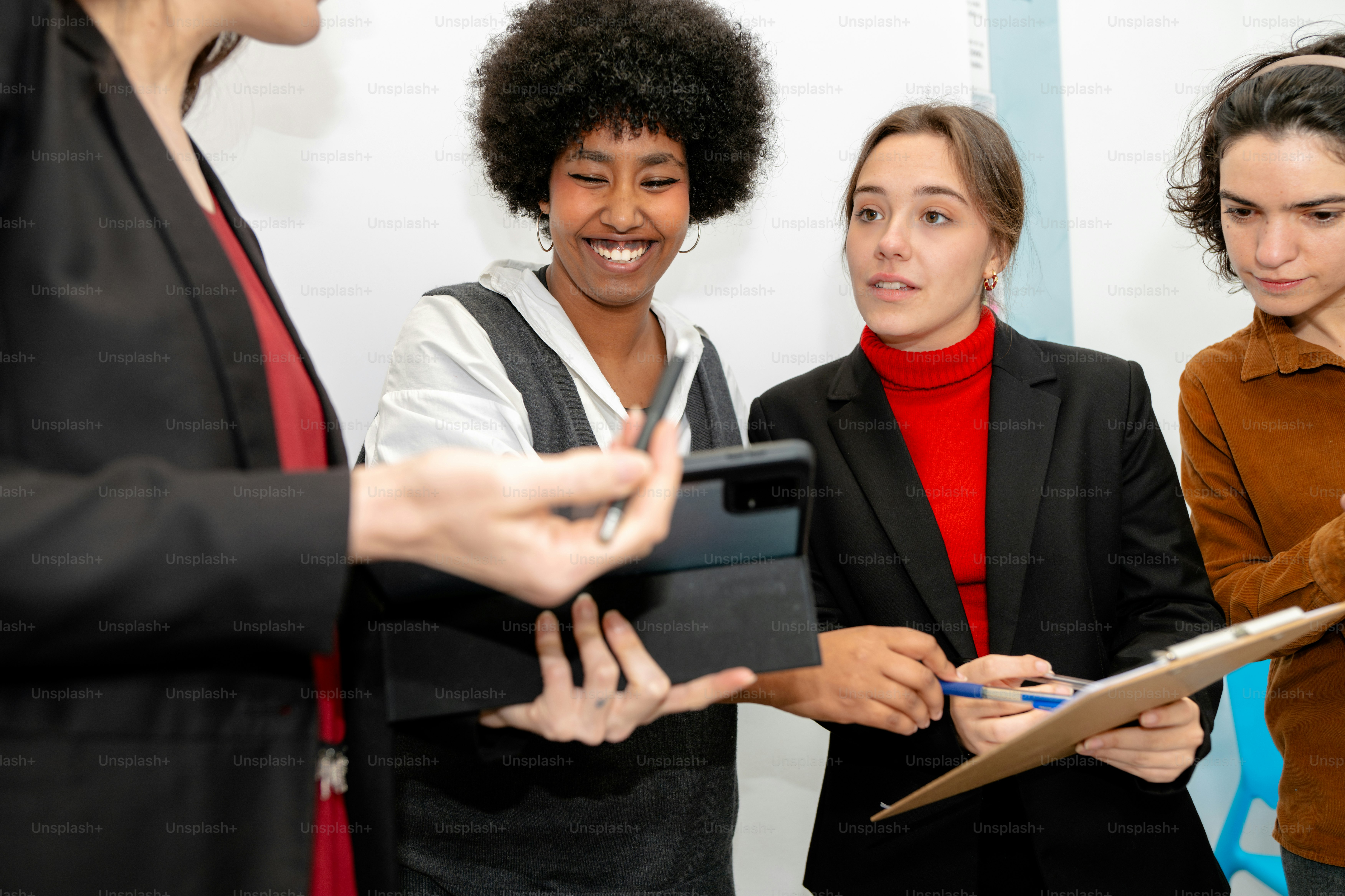 A group of people standing around each other