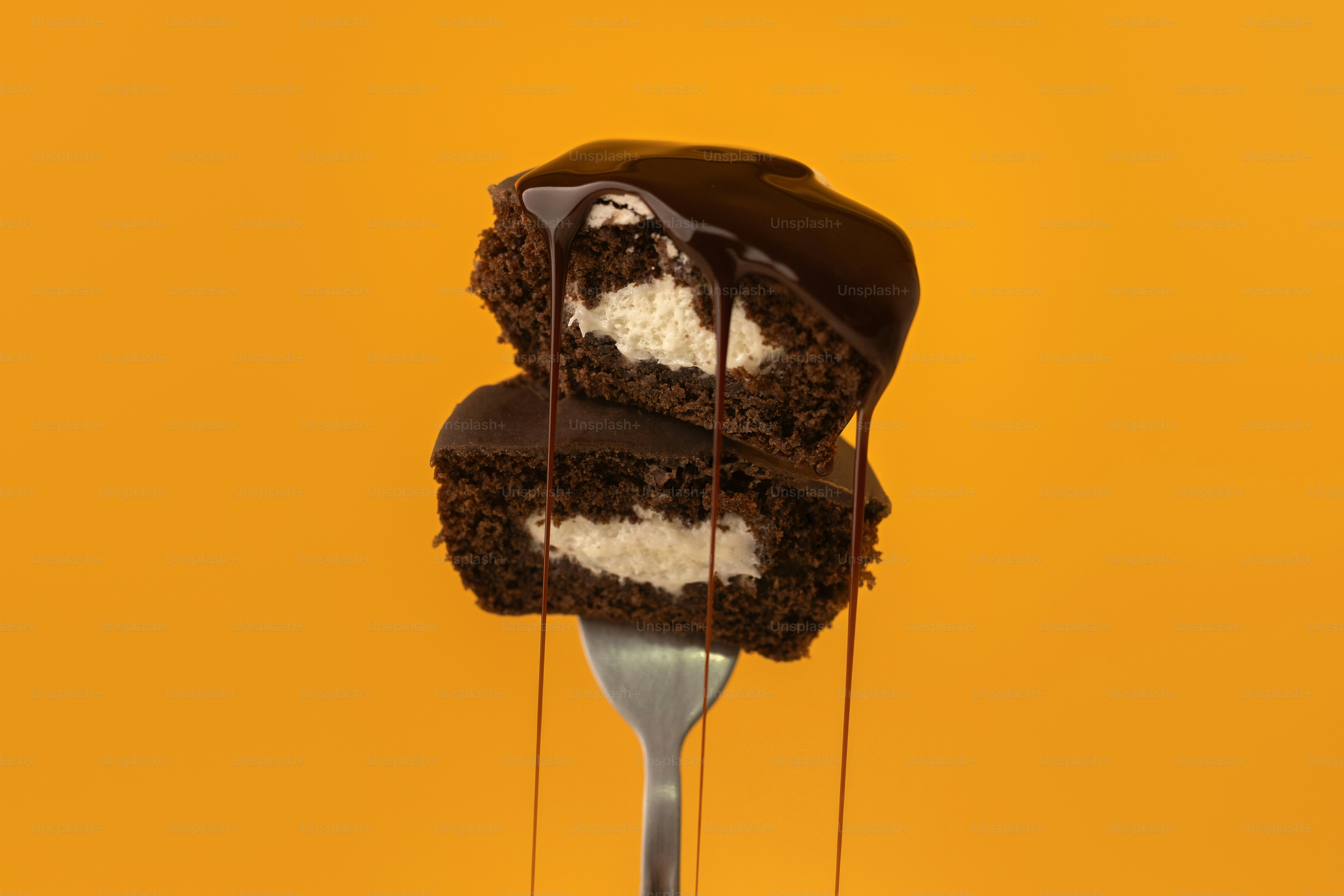A fork with a piece of cake on top of it