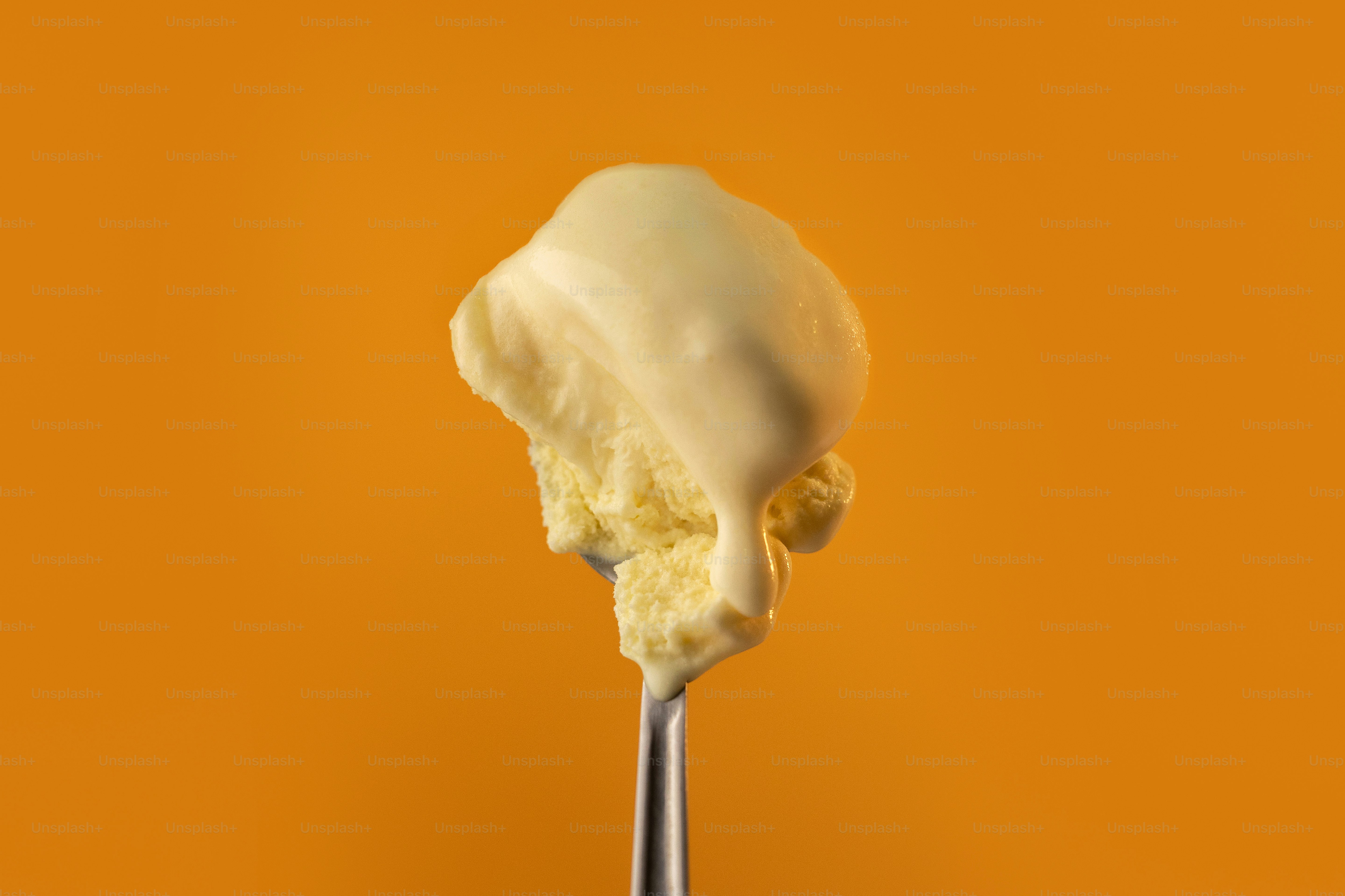 A spoon with a scoop of ice cream on it