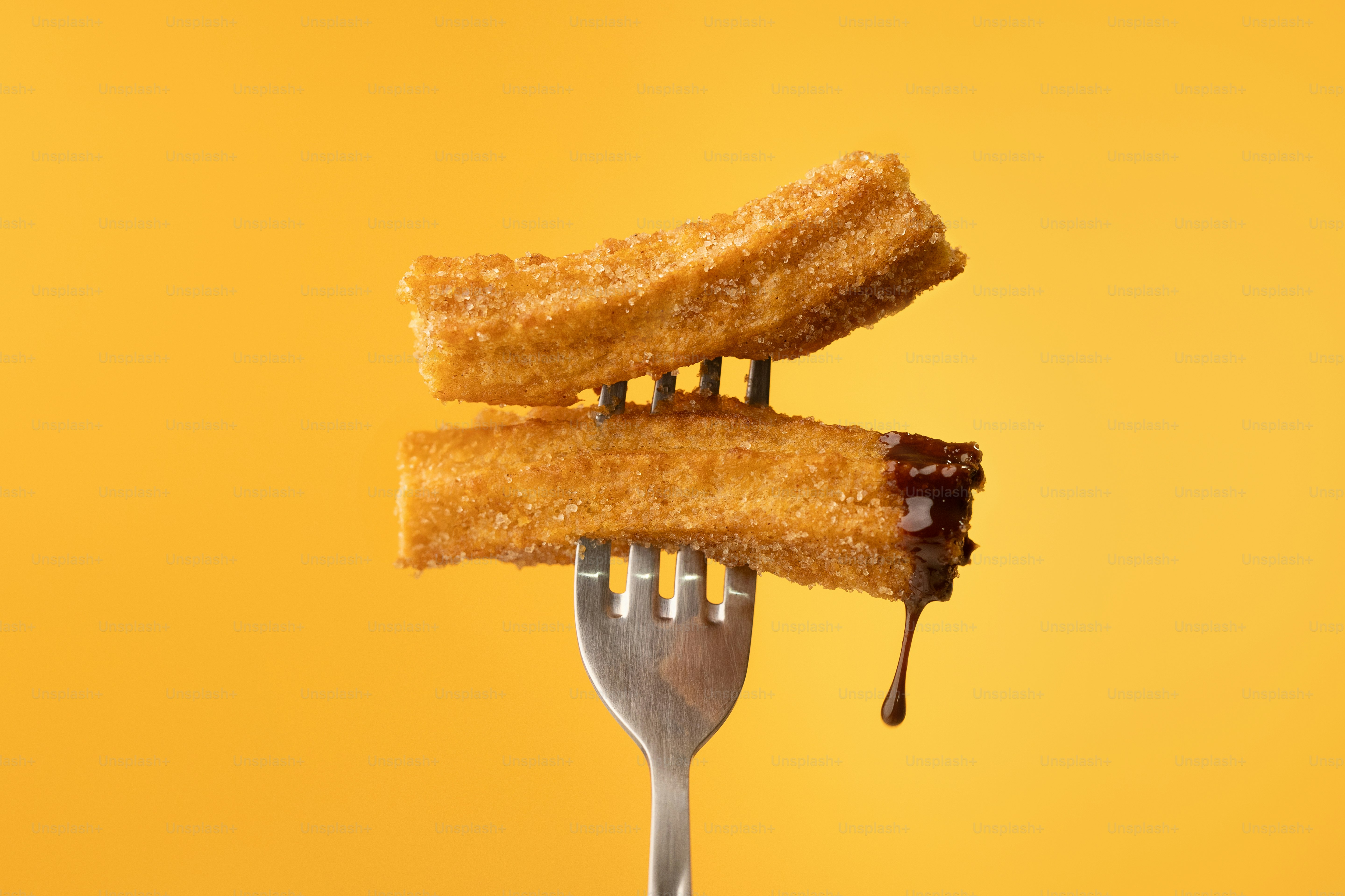 A fork with some food on top of it