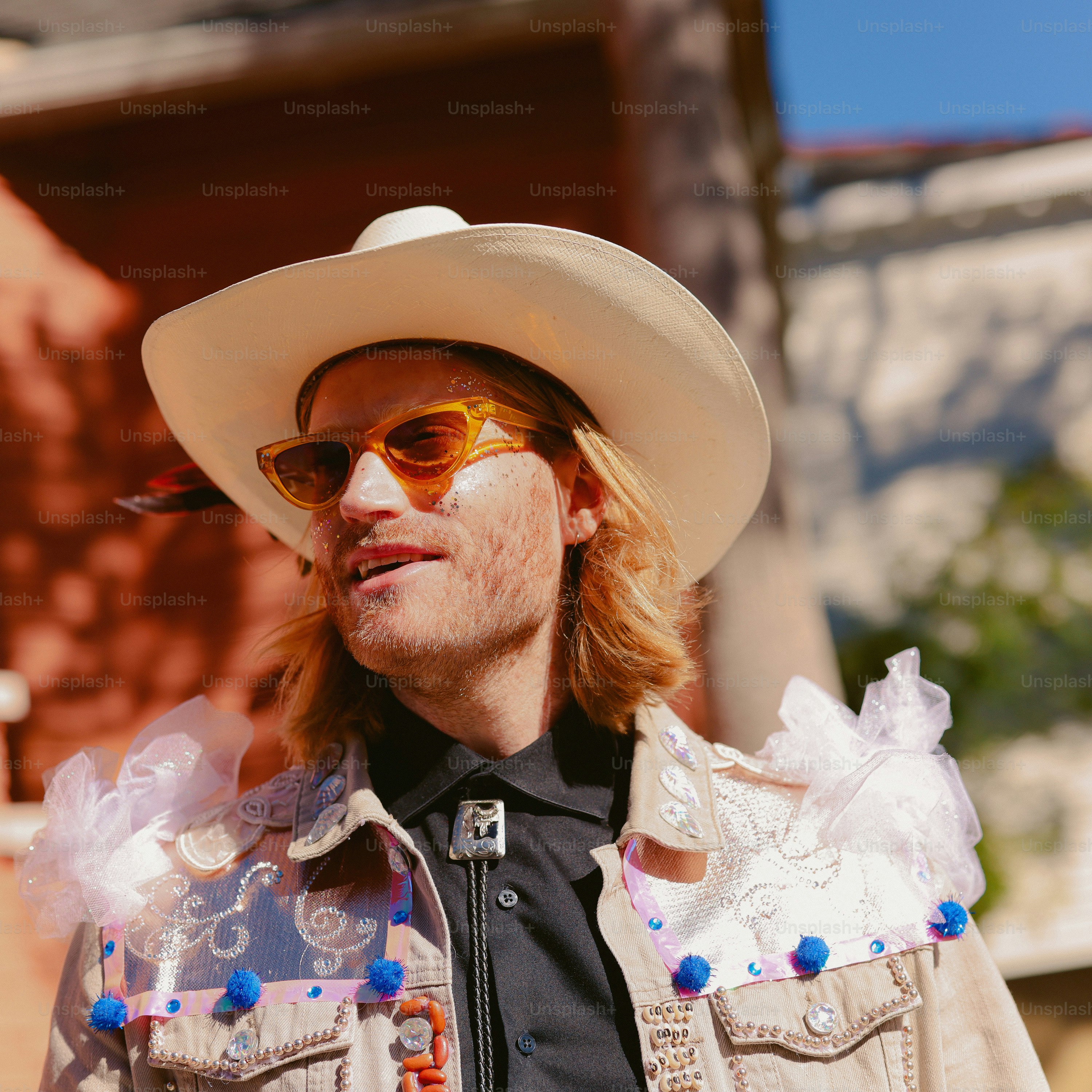 A man wearing a cowboy hat and sunglasses photo – Fashion Image on Unsplash