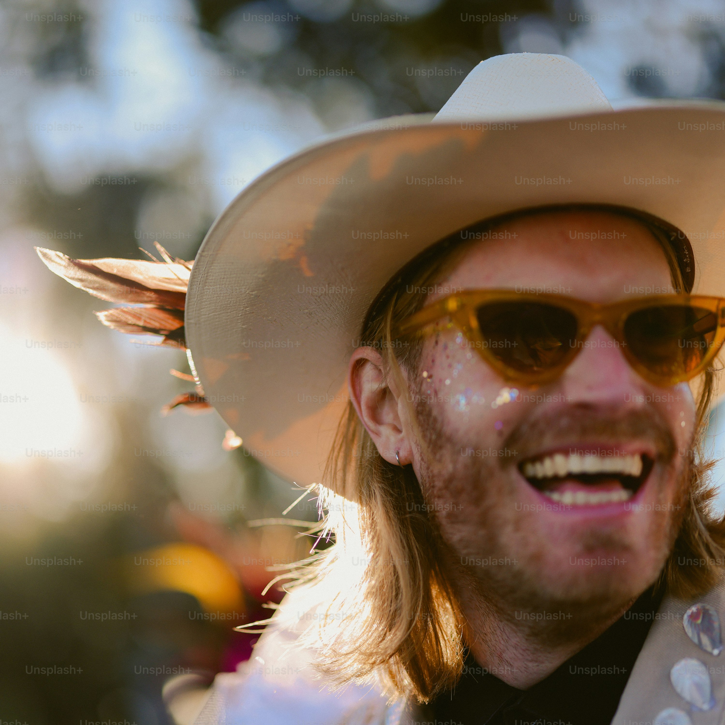 A man in a cowboy hat looking off into the distance photo – Portrait ...