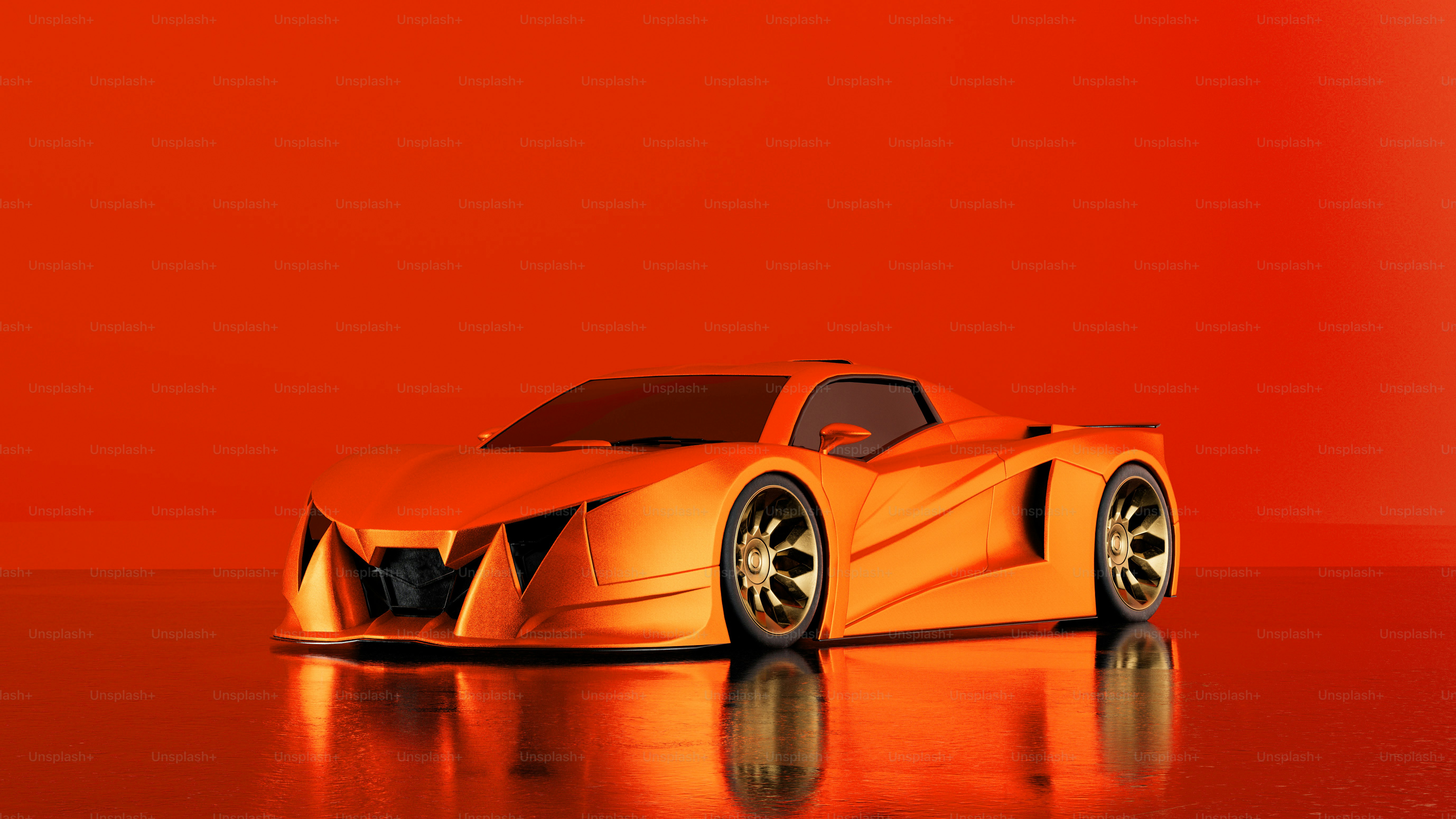 光沢のある表面の上に座っているオレンジ色の車