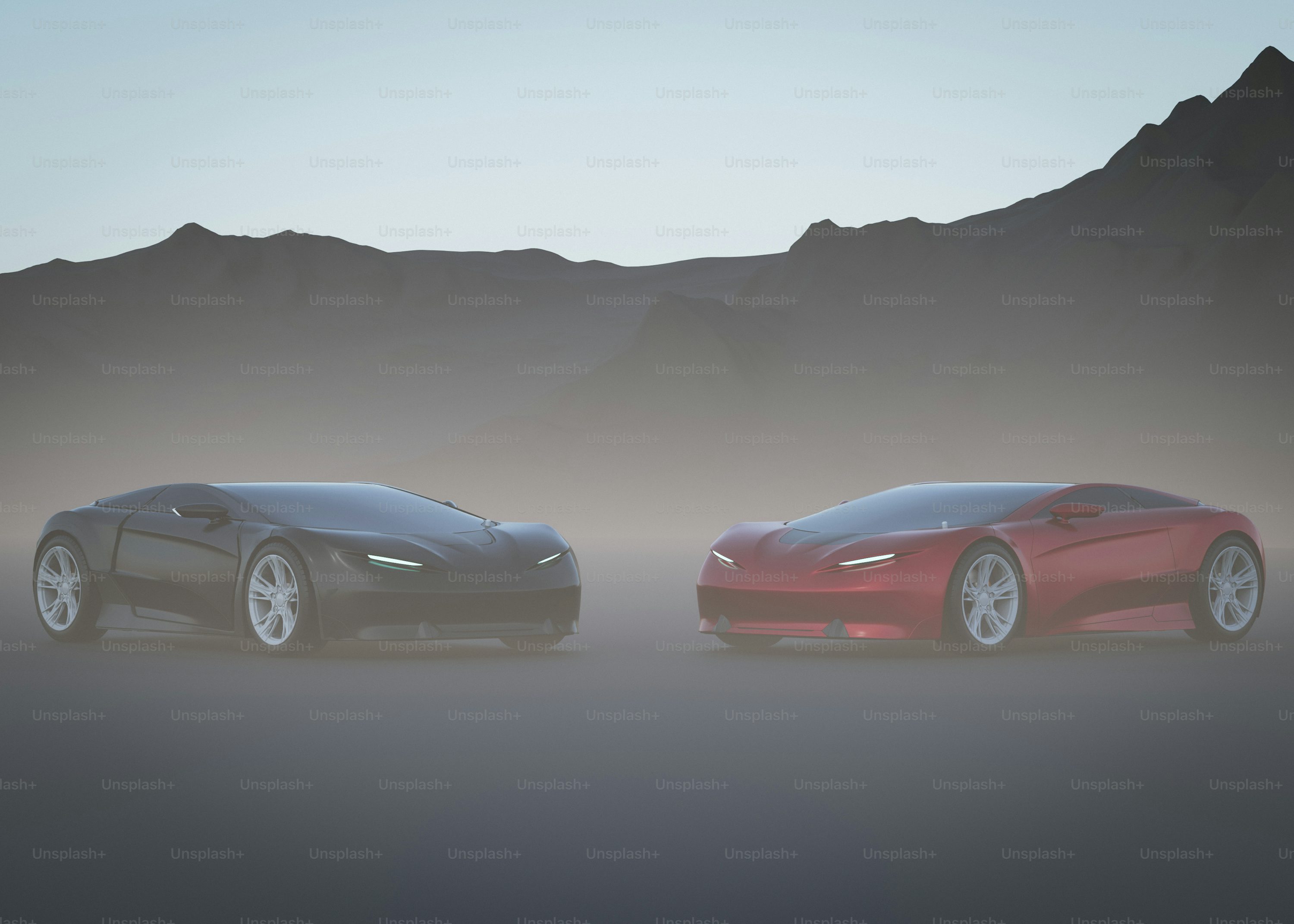 Two red and black sports cars in front of a mountain