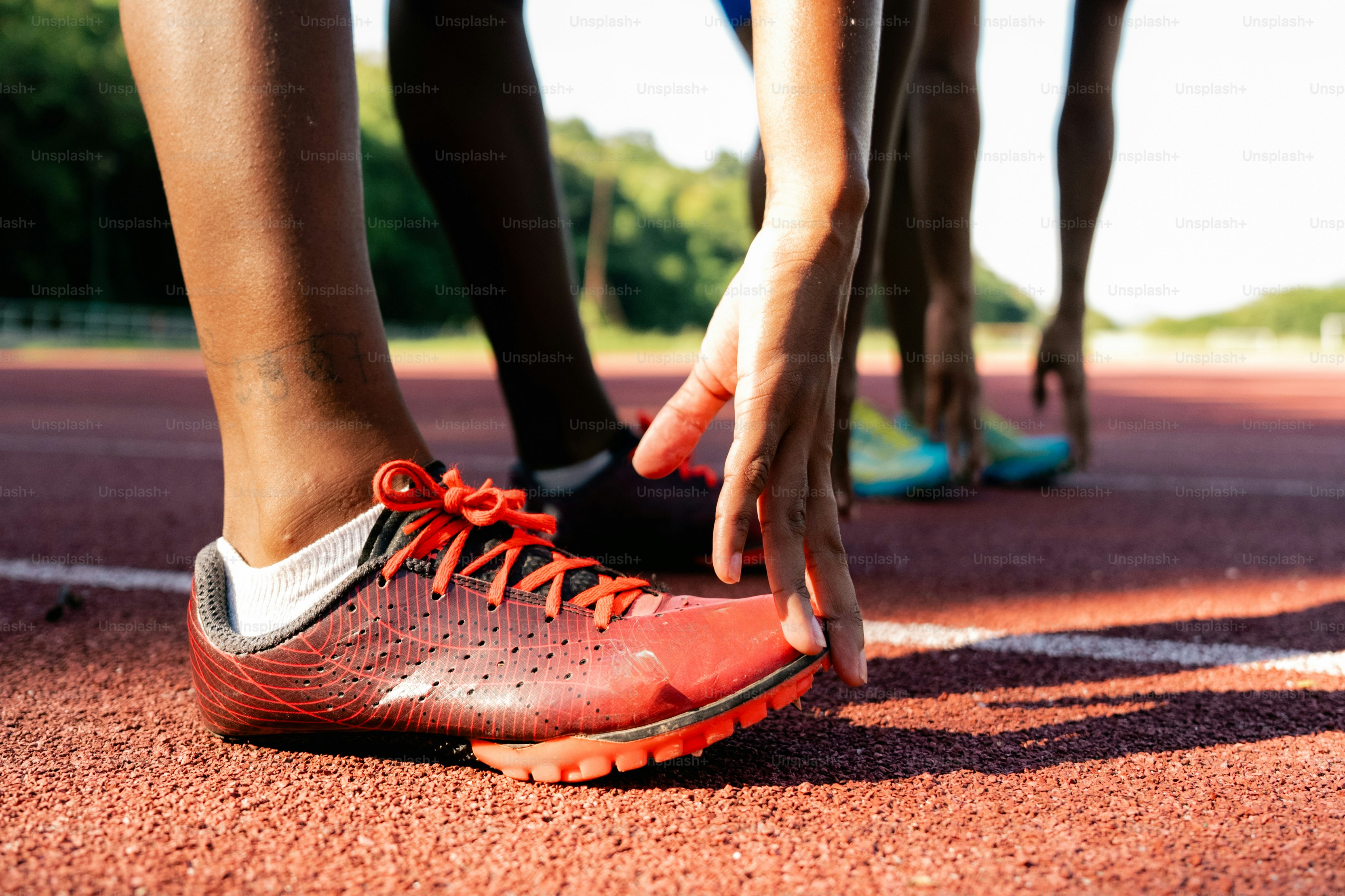 A close up of a person tying their shoes