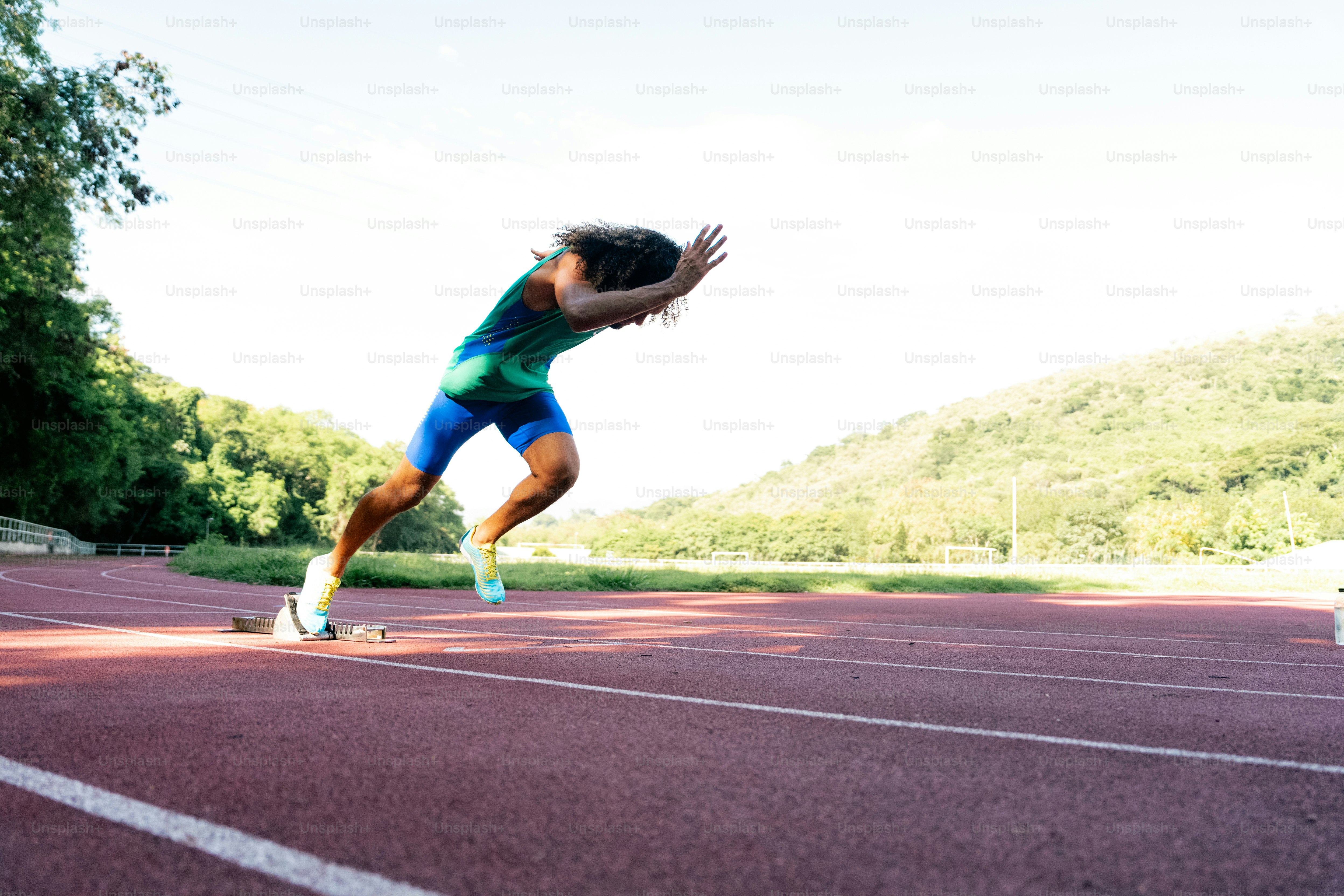 A woman is running on a running track