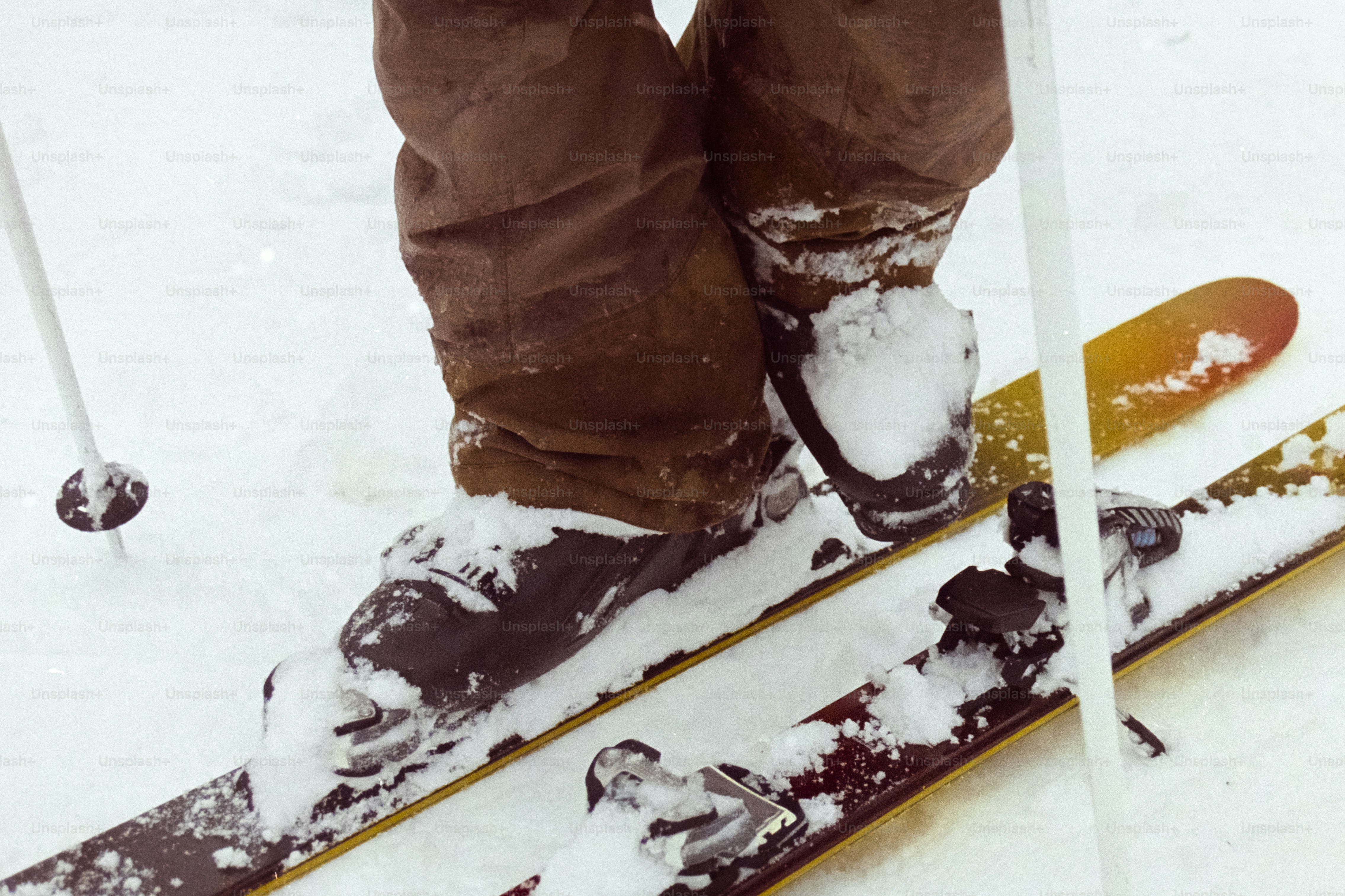 A person standing on a pair of skis in the snow