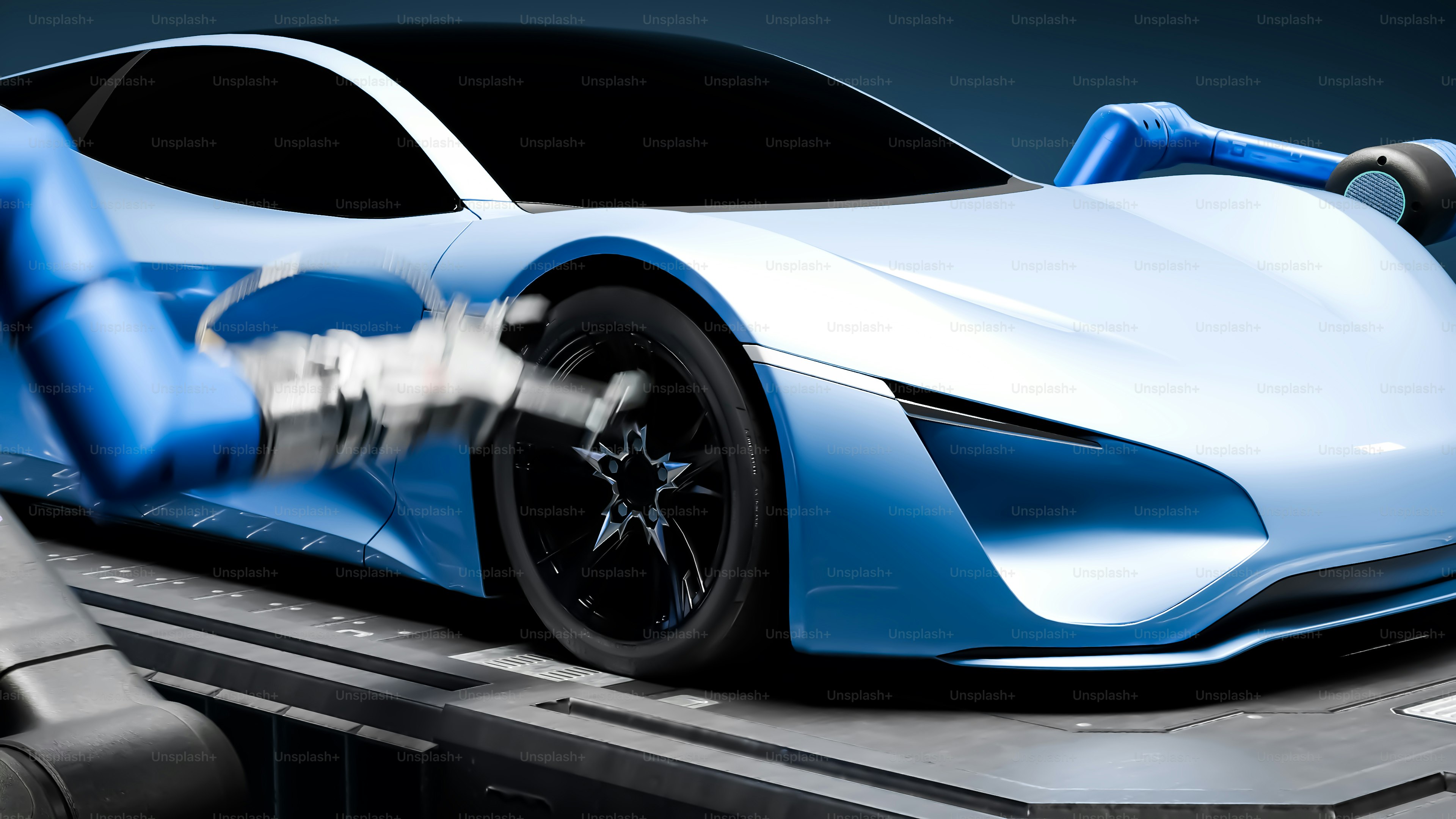 A blue and white car on a conveyor belt