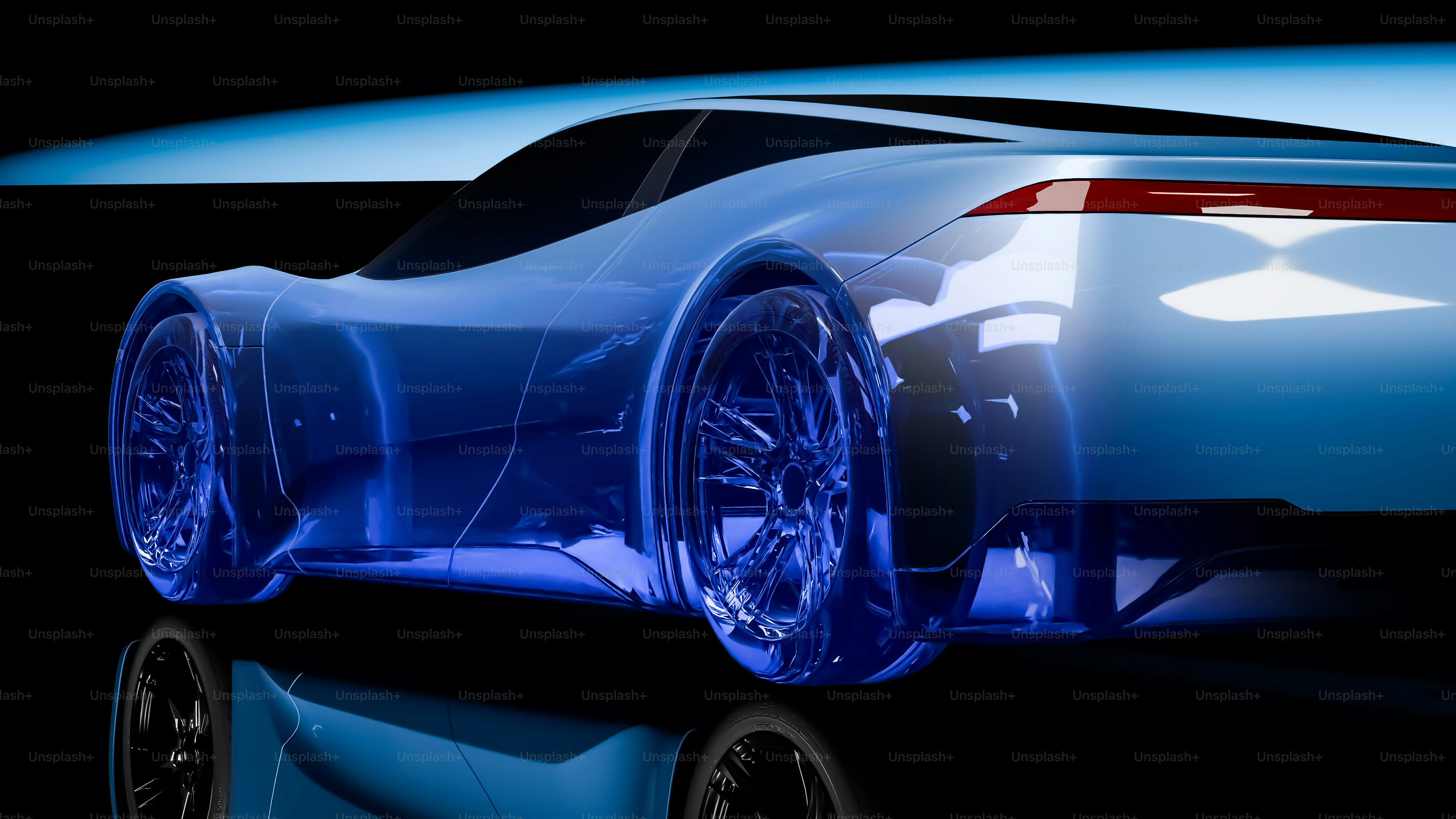 A blue car is shown in a black background