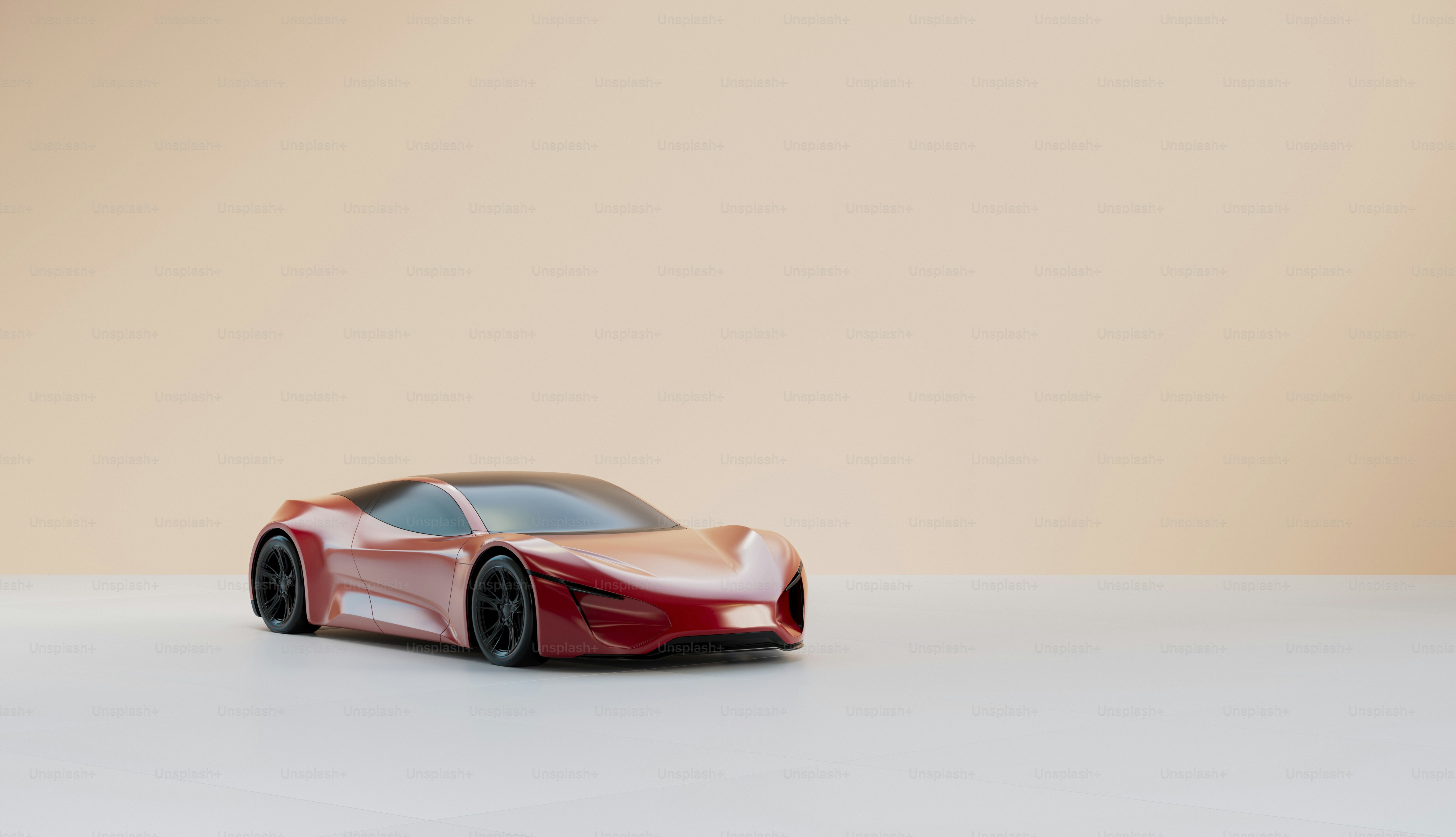 A red toy car sitting on top of a white table