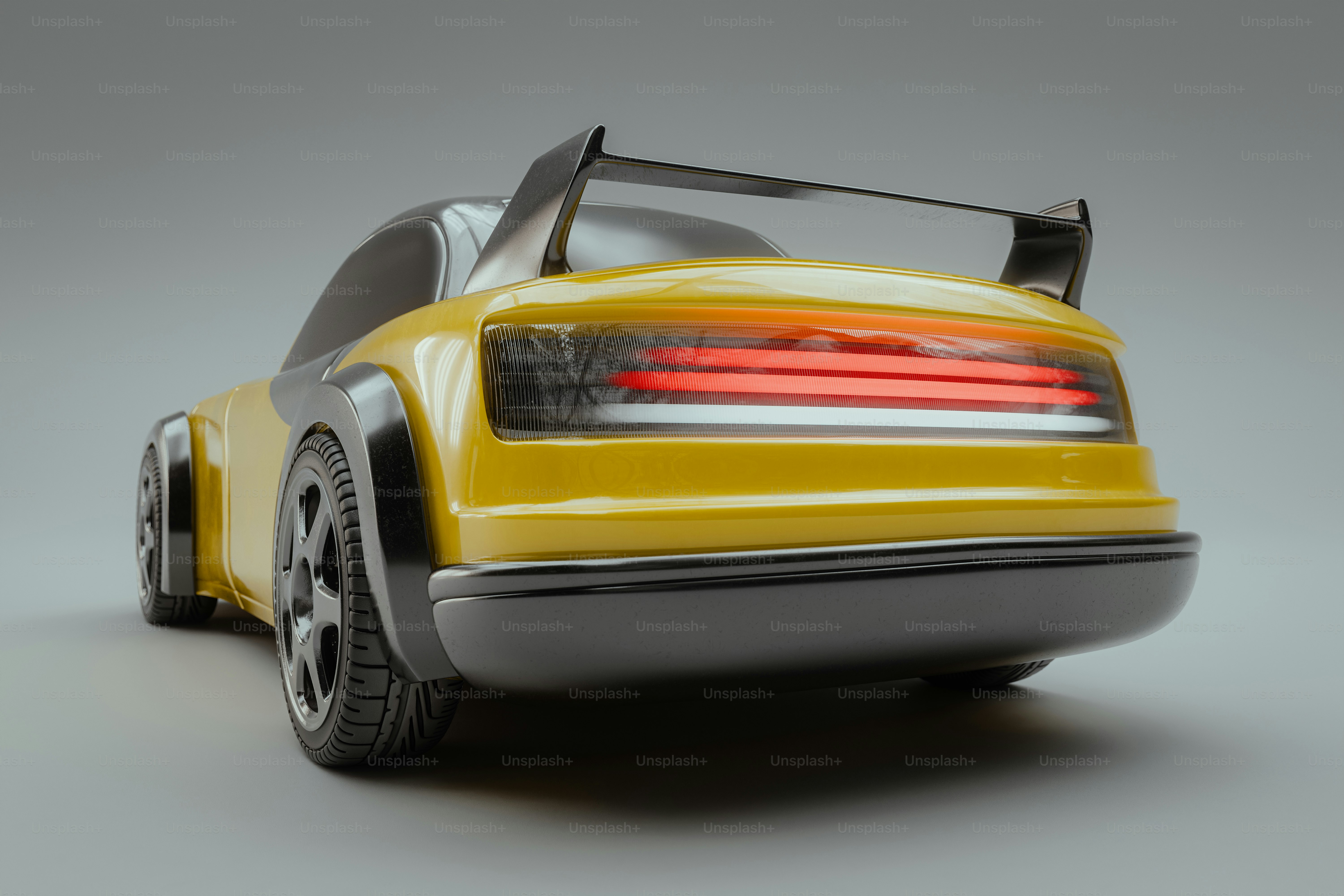 A yellow toy car with a red light on top of it