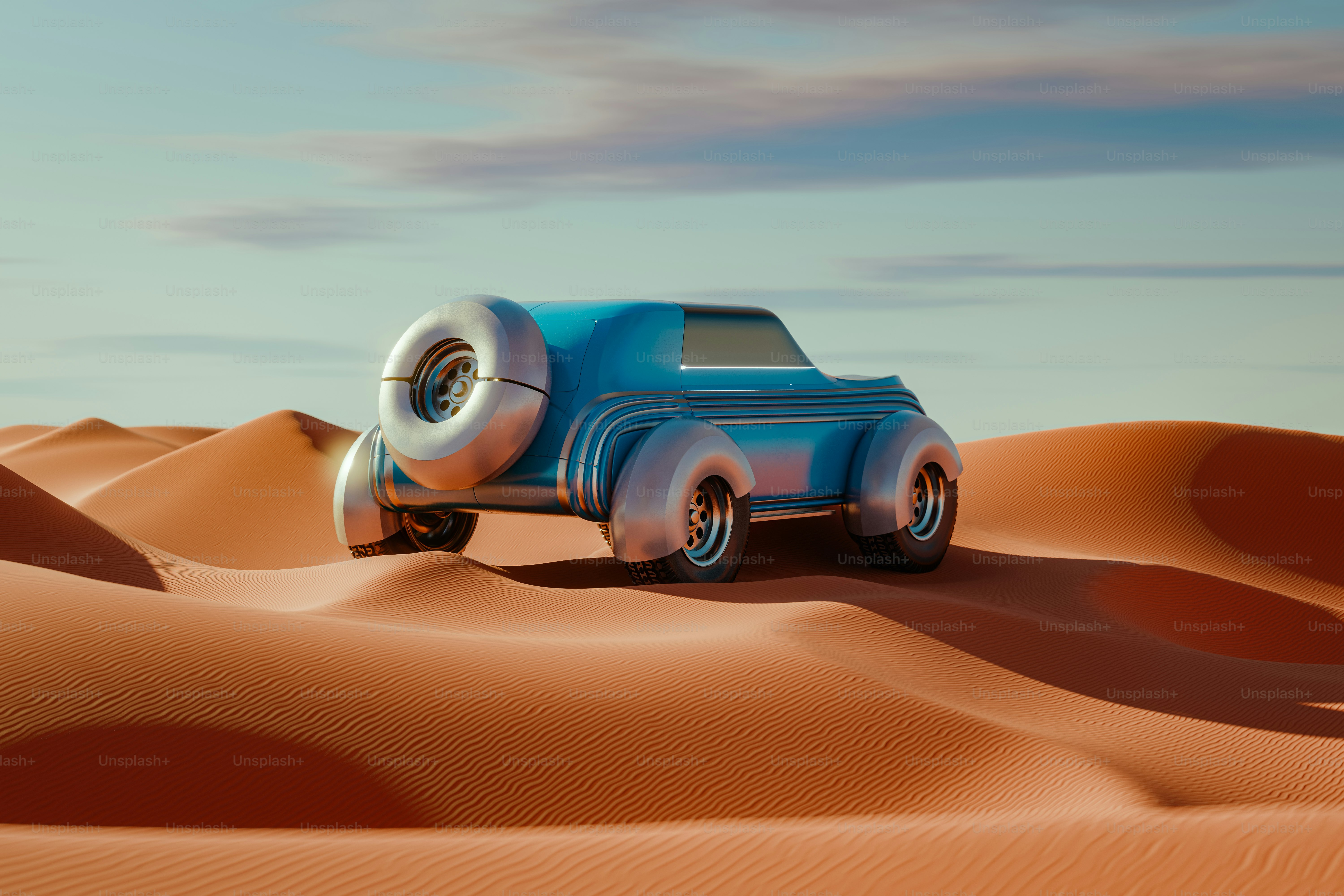 A blue truck driving across a desert covered in sand