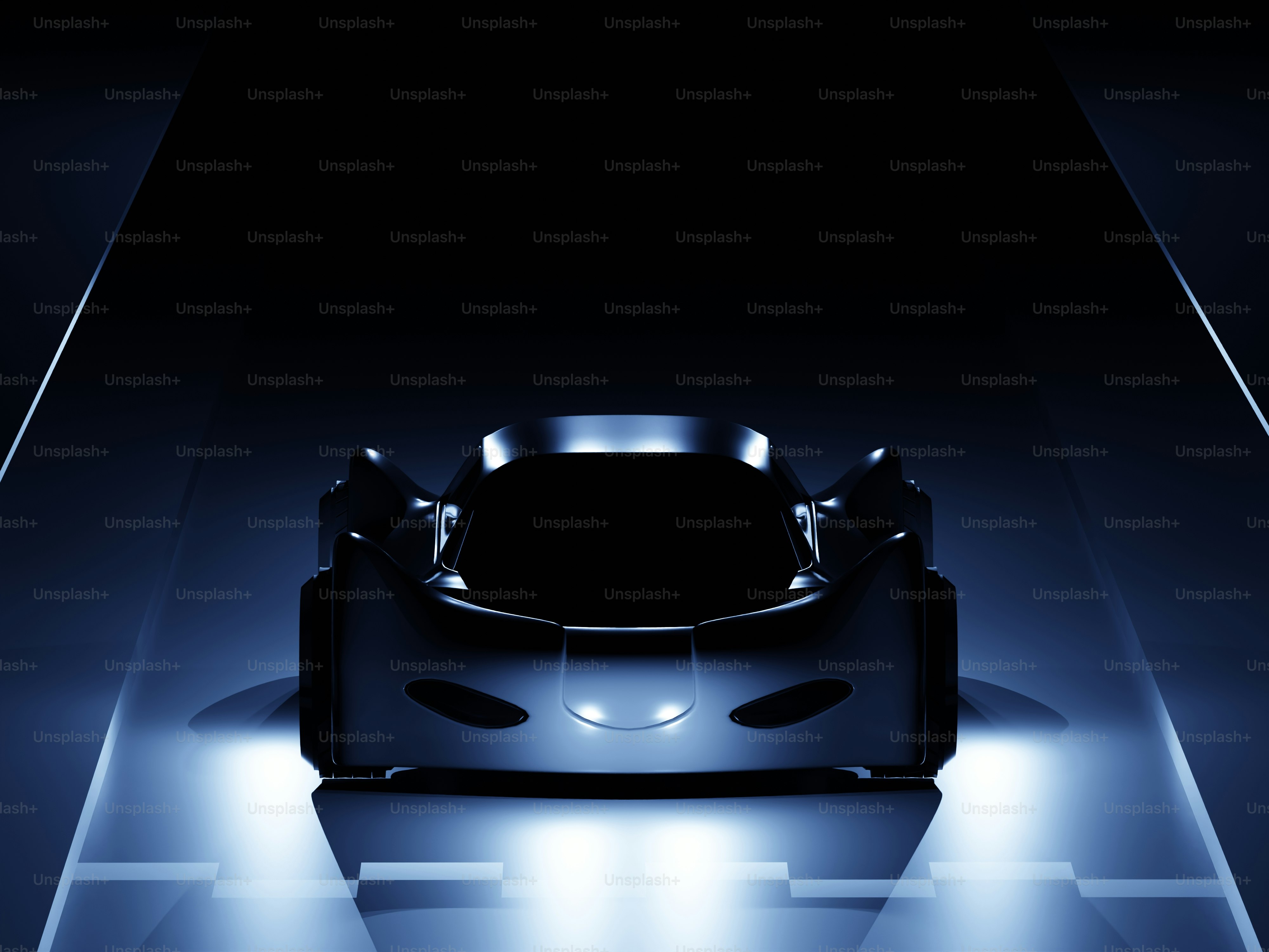 A futuristic car is shown in the dark