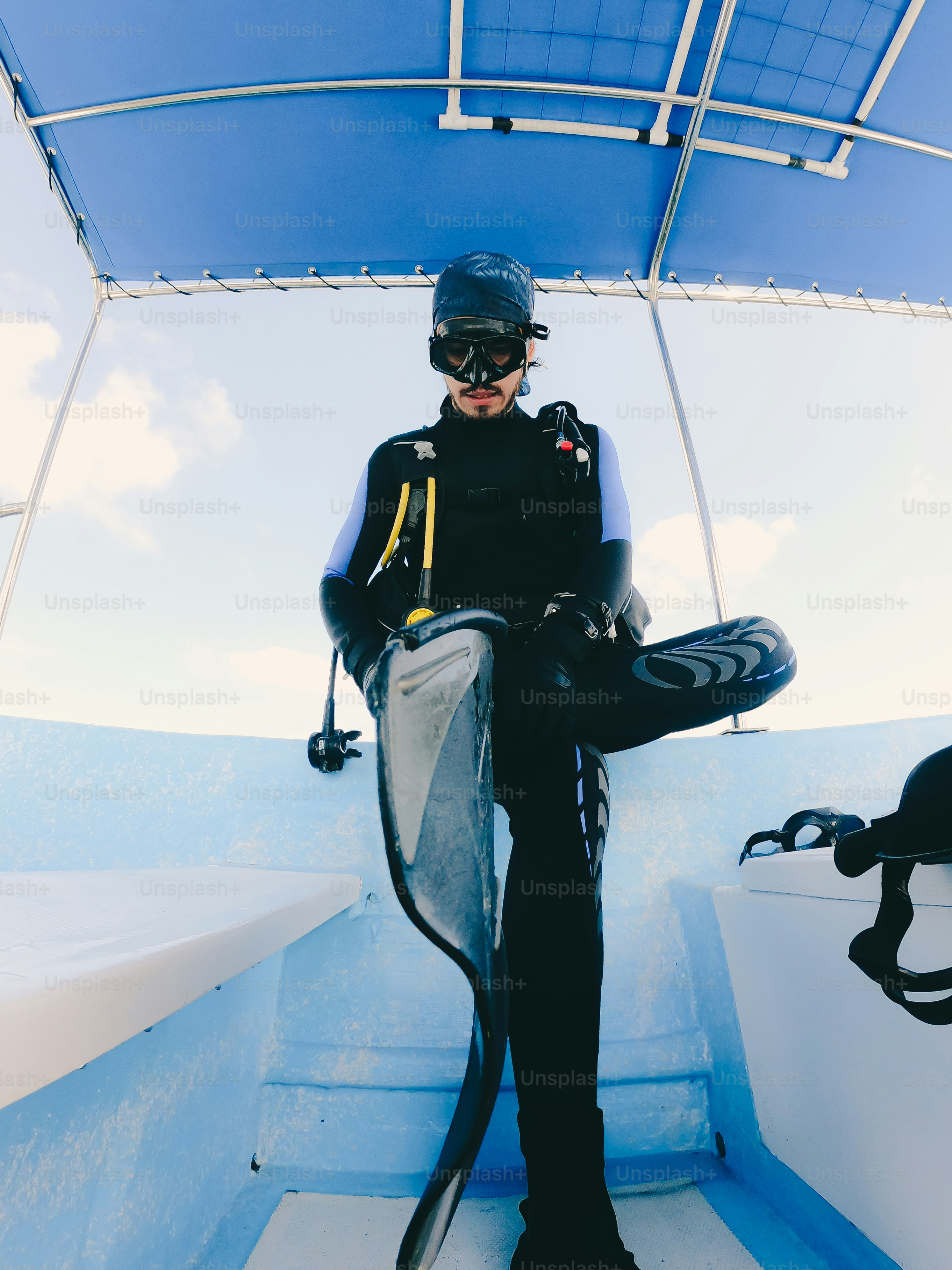 A person sitting on a boat in the water