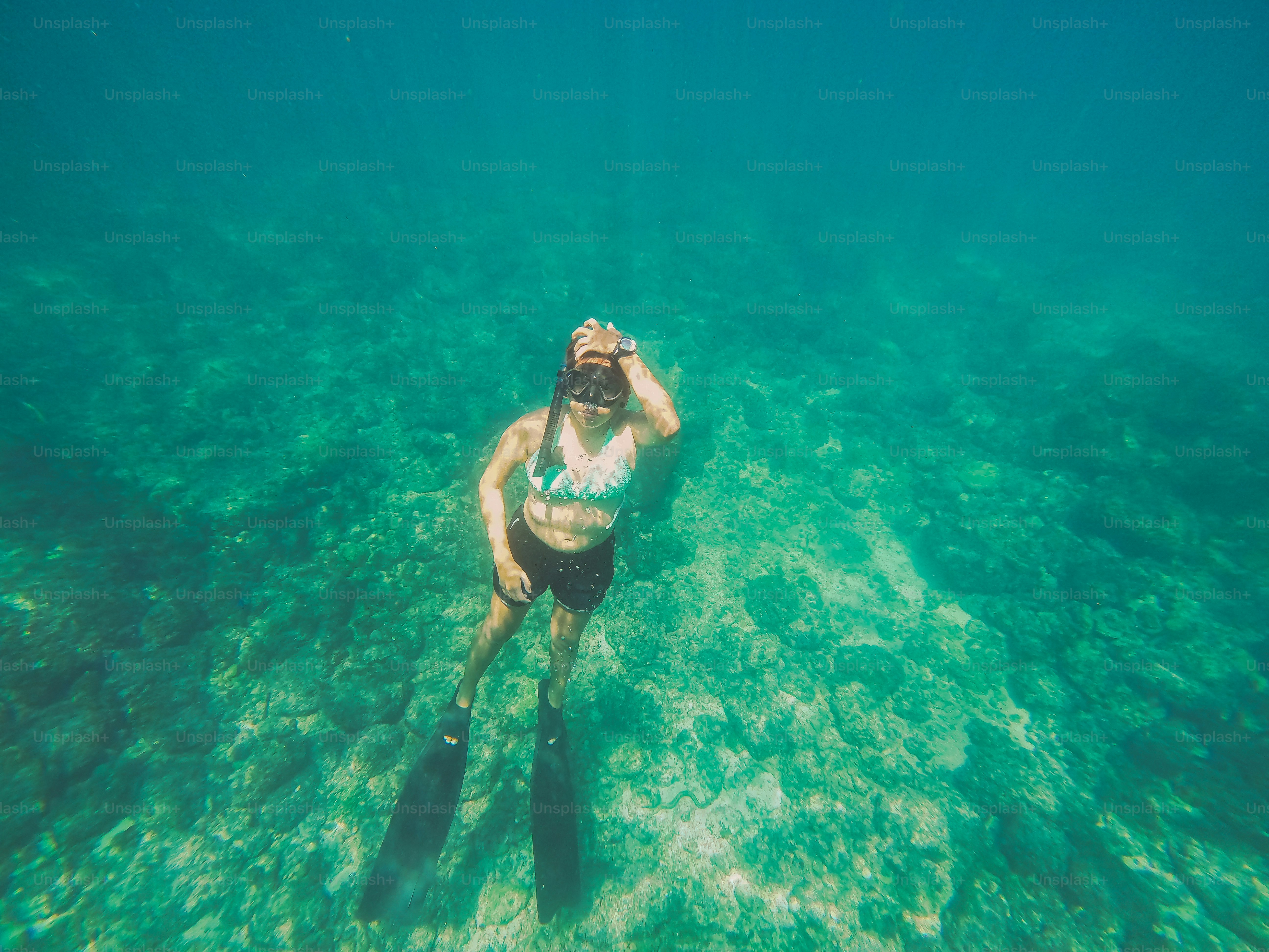 A man riding on top of a surfboard in the ocean
