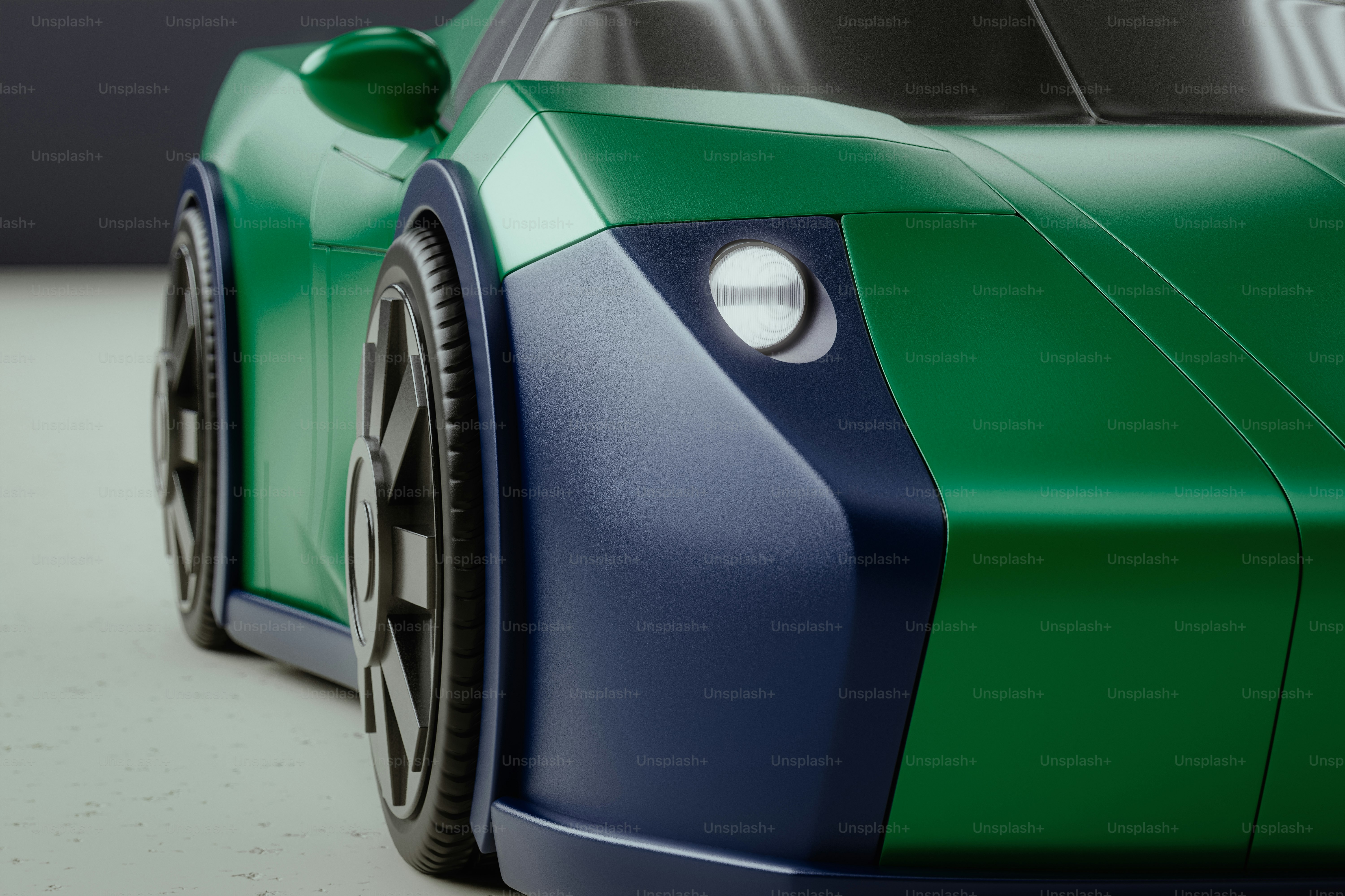 白い表面に緑と青のスポーツカー