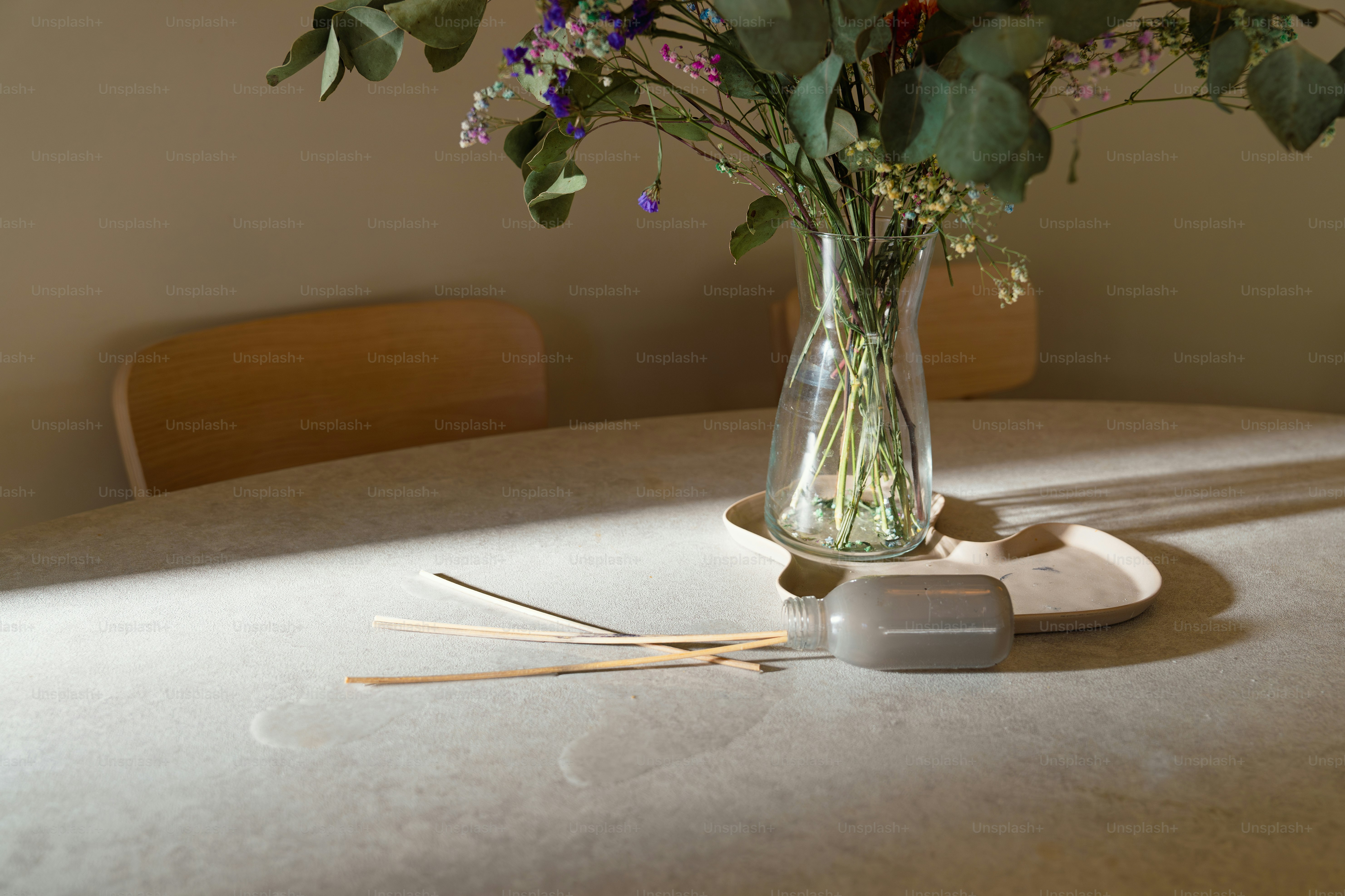 A vase filled with flowers sitting on top of a table