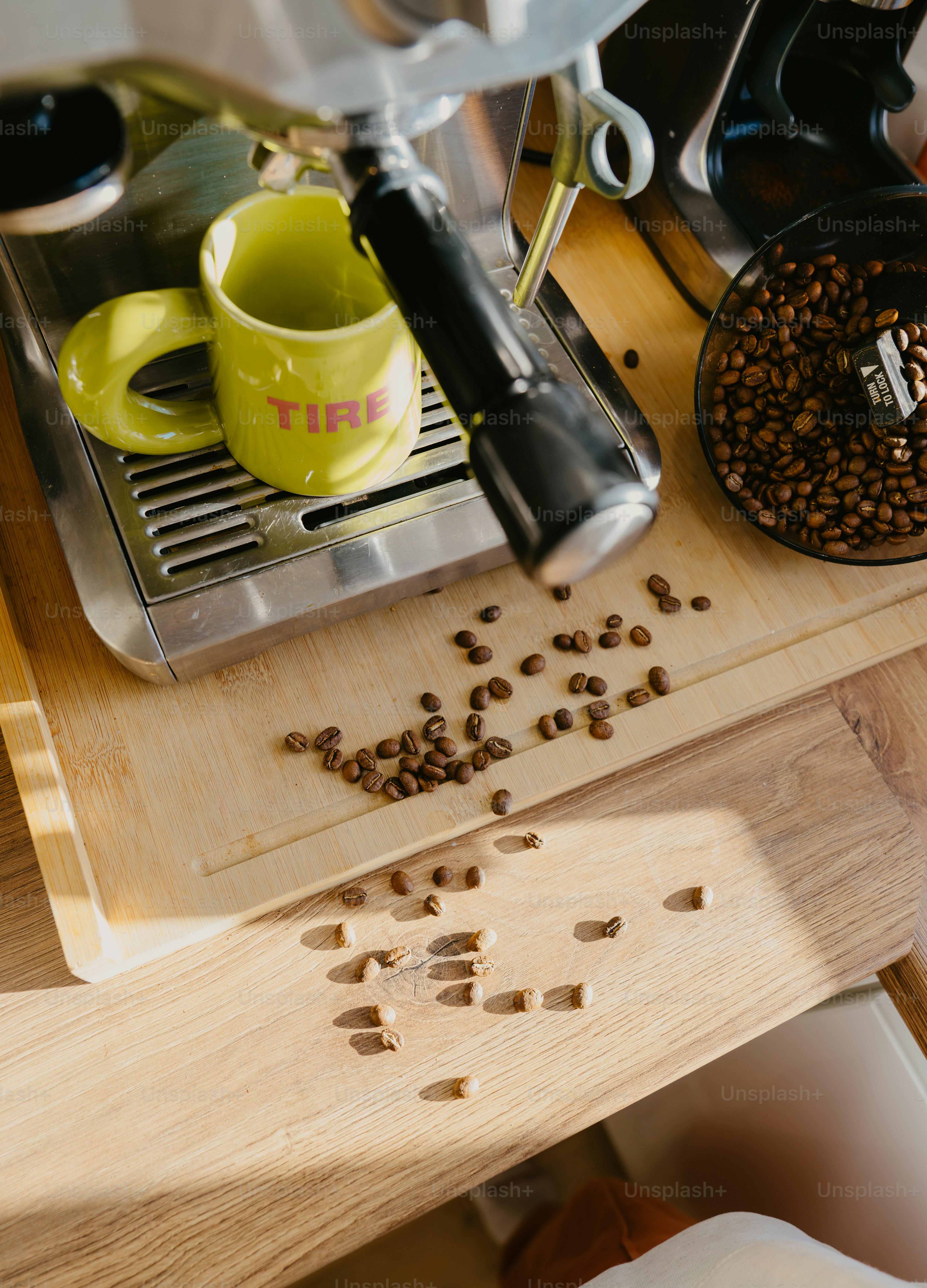 A wooden cutting board topped with lots of coffee beans