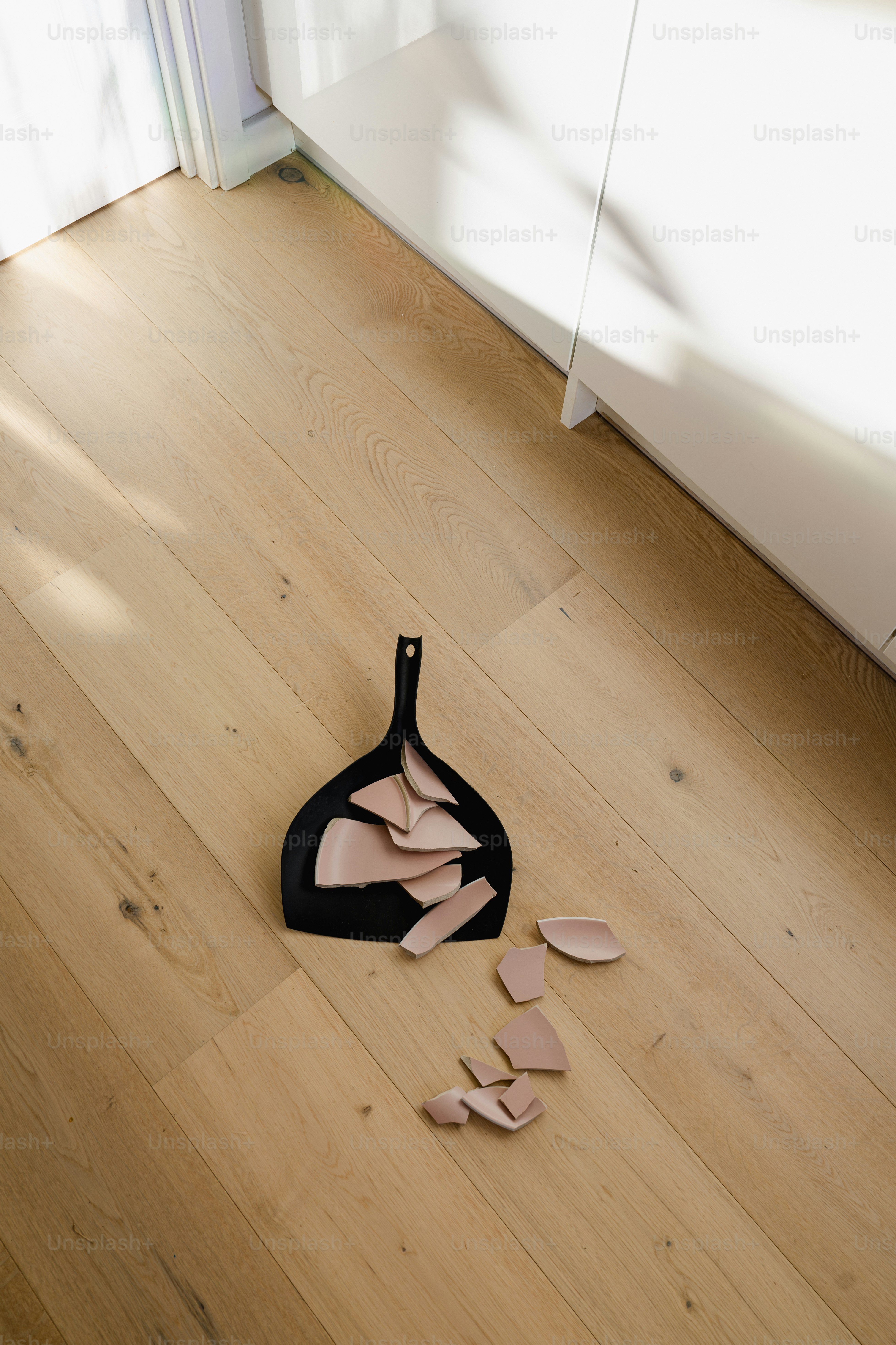 A pair of shoes sitting on top of a wooden floor