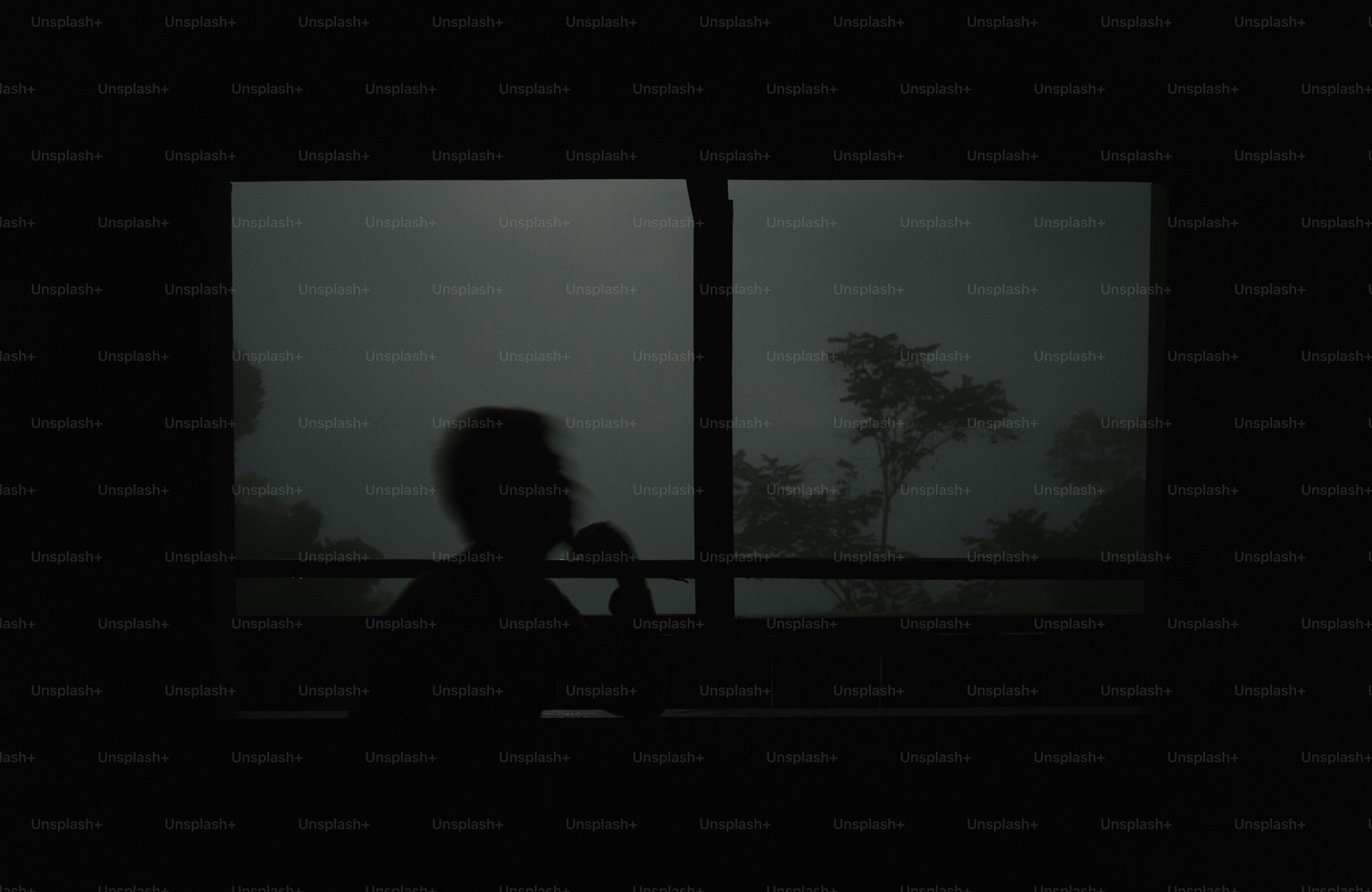 Fogged window with blurred silhouette, representing uncertainty and self-conflict