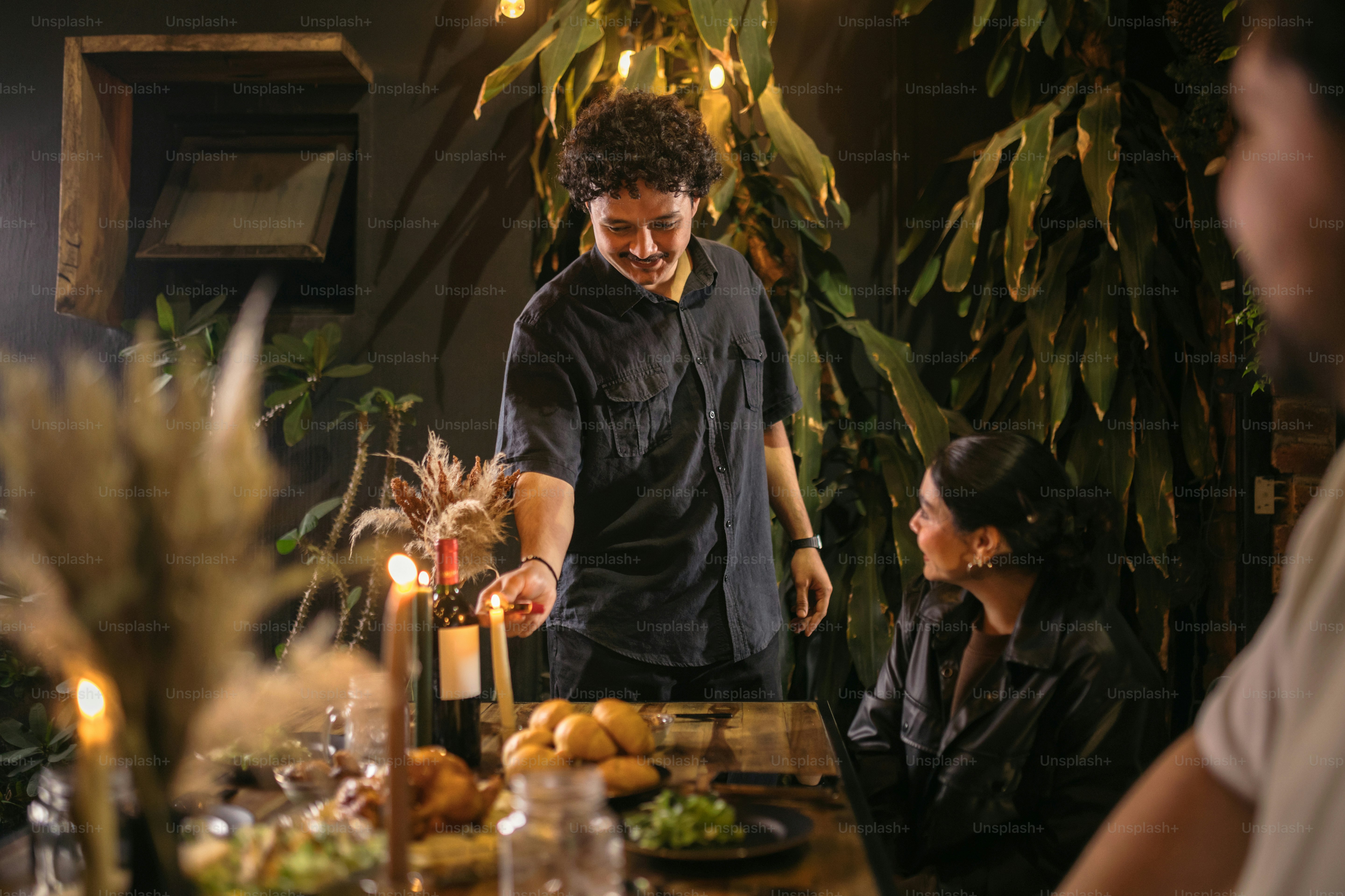 A group of people sitting around a wooden table