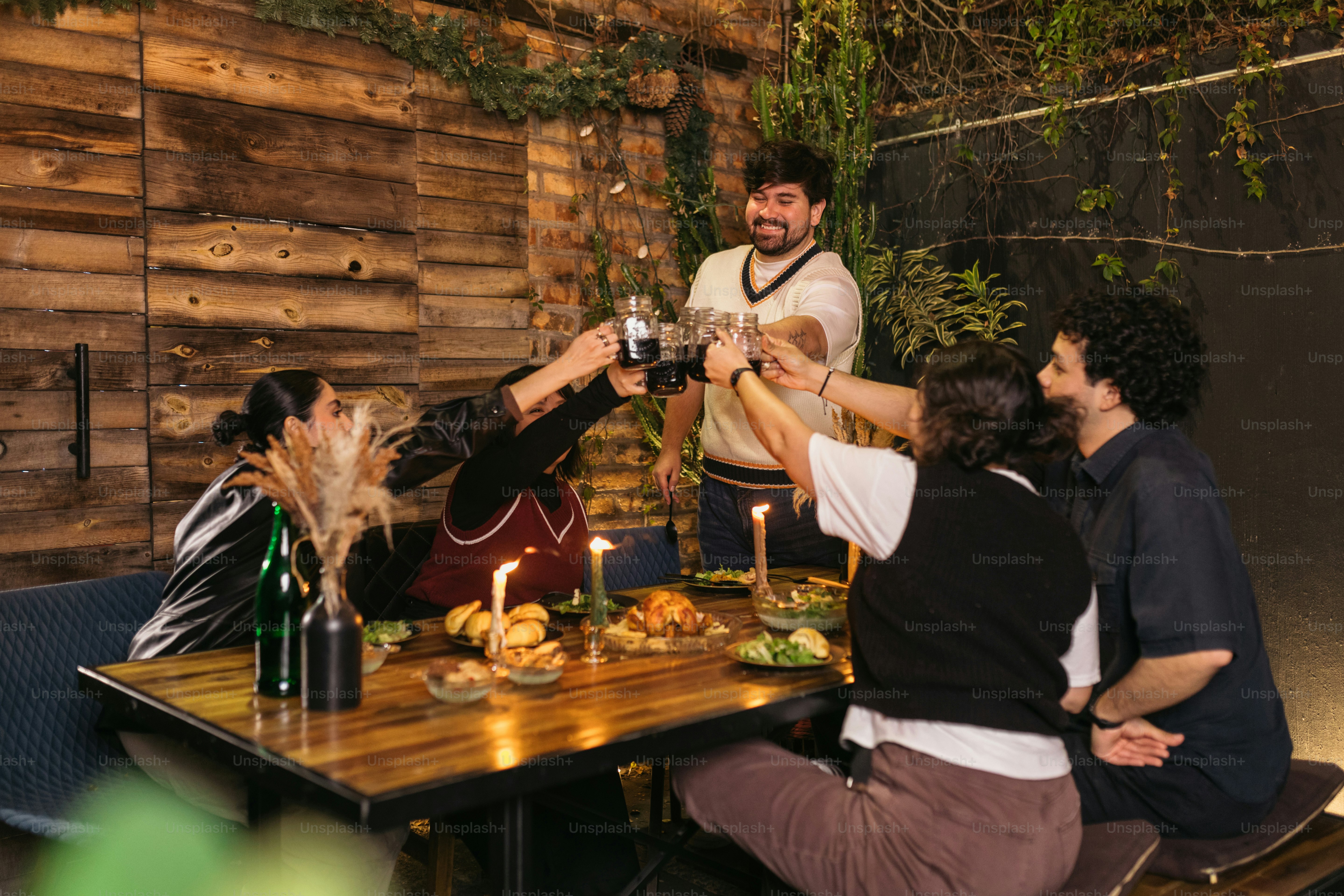 A group of people sitting around a wooden table