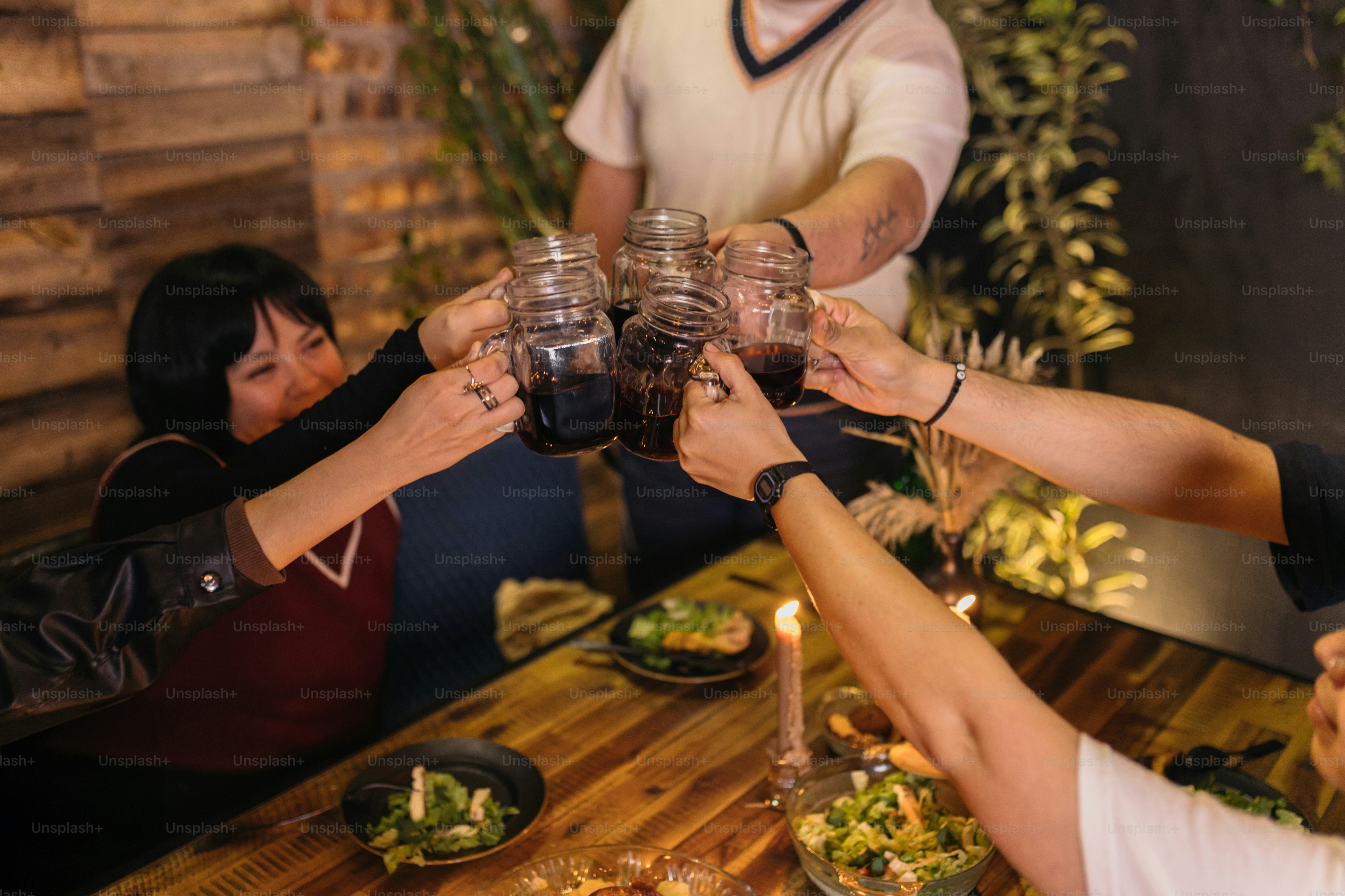 A group of people sitting around a wooden table