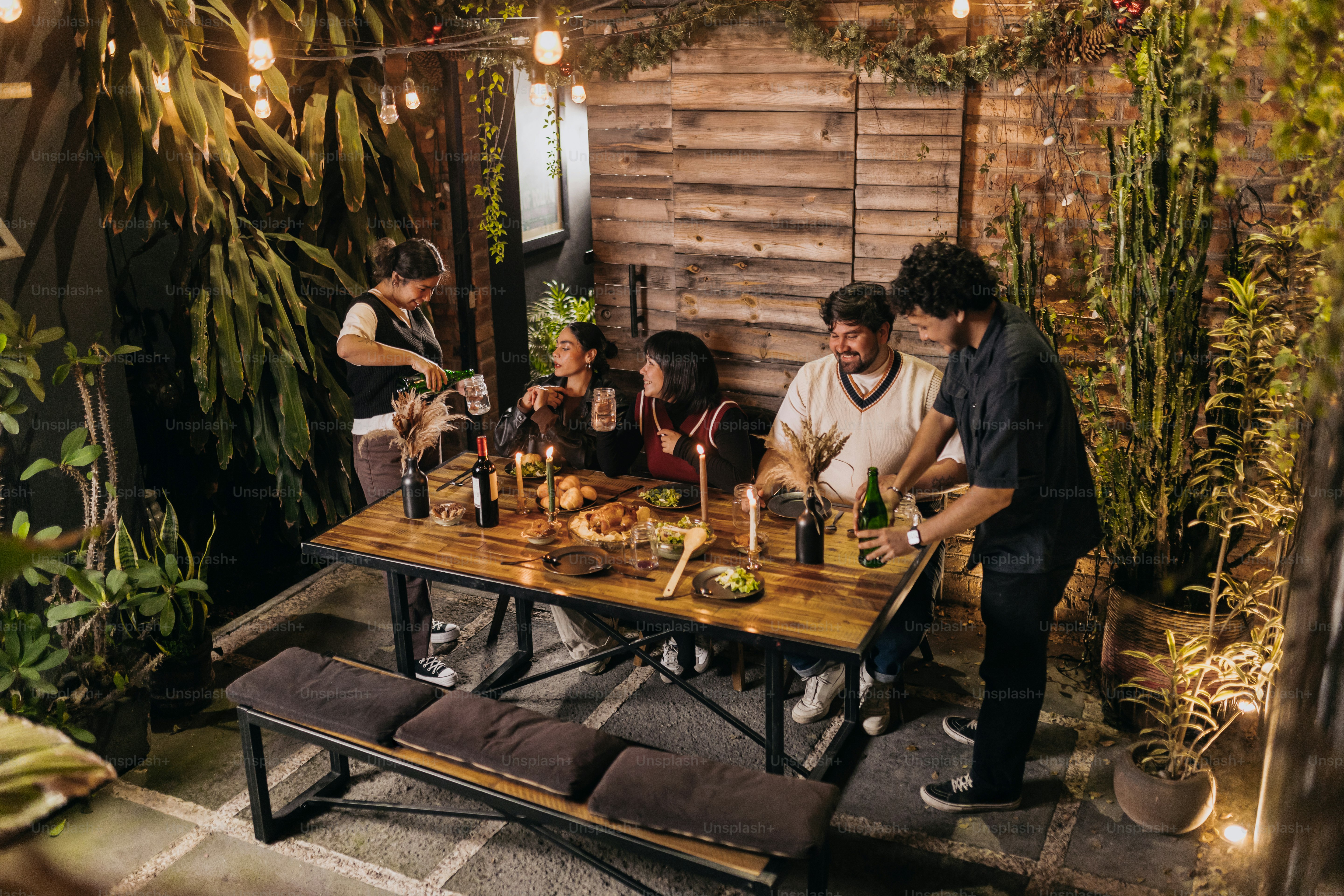 A group of people sitting around a wooden table